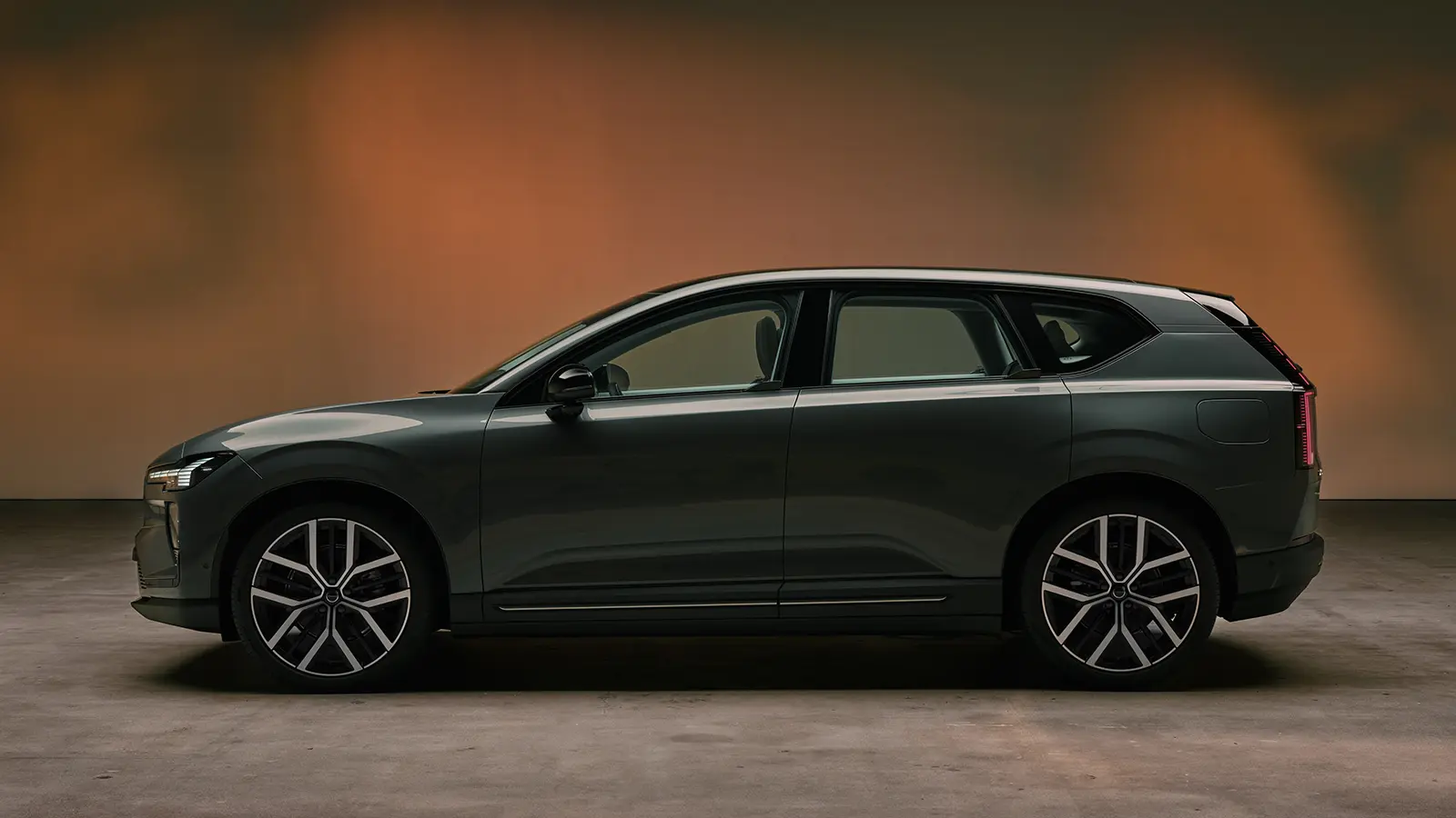 A dark gray 2027 Volvo EX60 side view