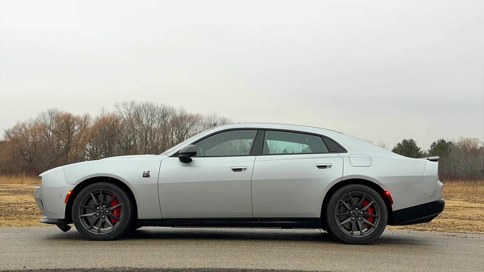 A silver 2026 Dodge Charger Daytona EV side view