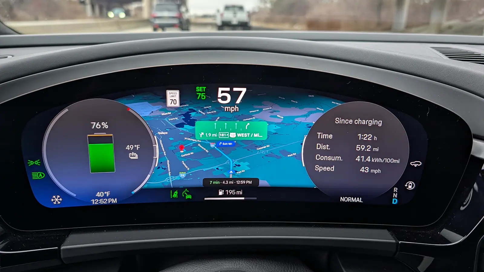 A light blue 2025 Porsche Macan 4S driver speedometer view