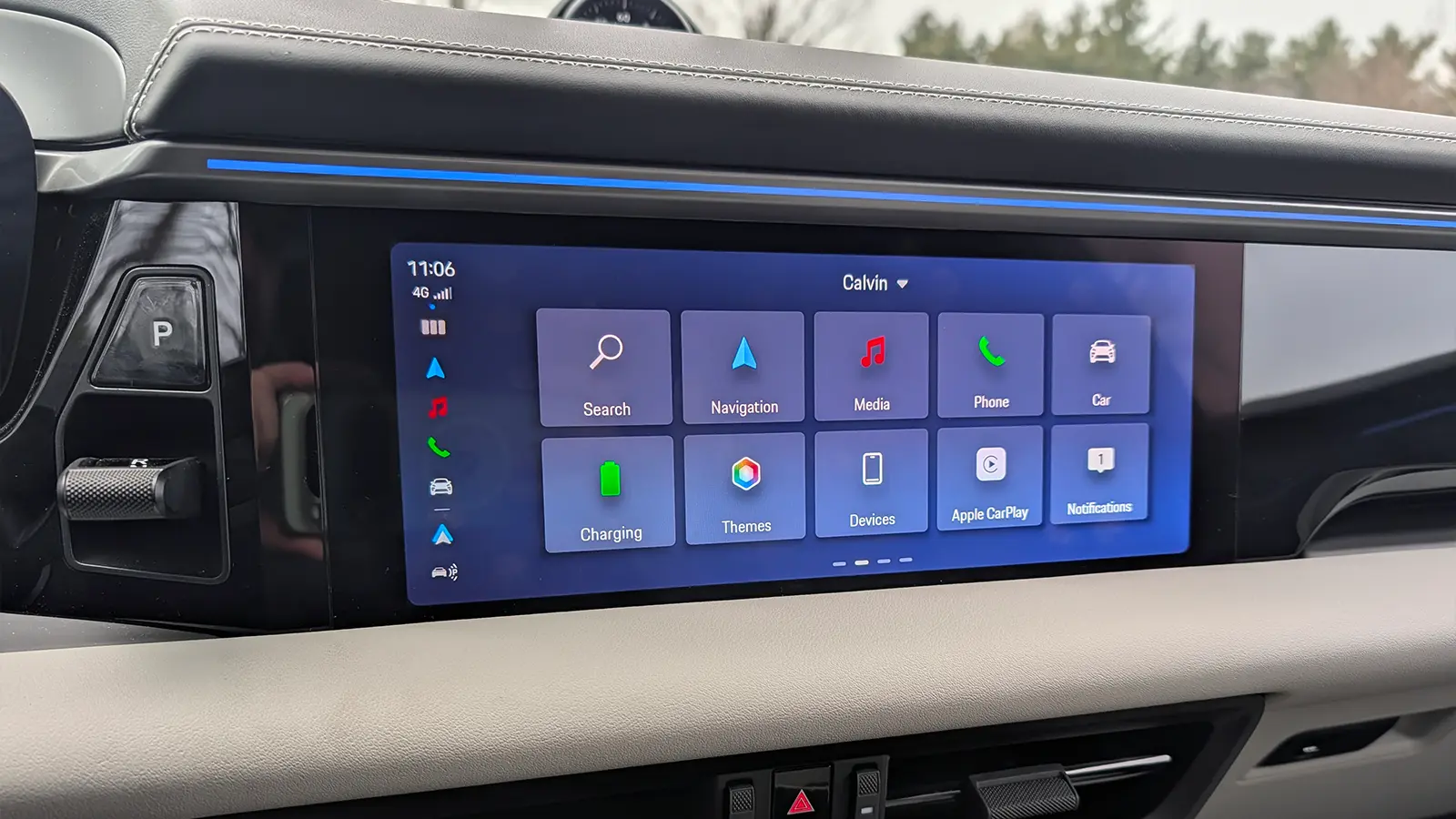A light blue 2025 Porsche Macan 4S drover HUD main navigation