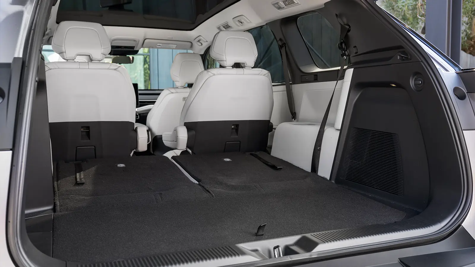 A 2027 Toyota Highlander EV white interior rear cargo view