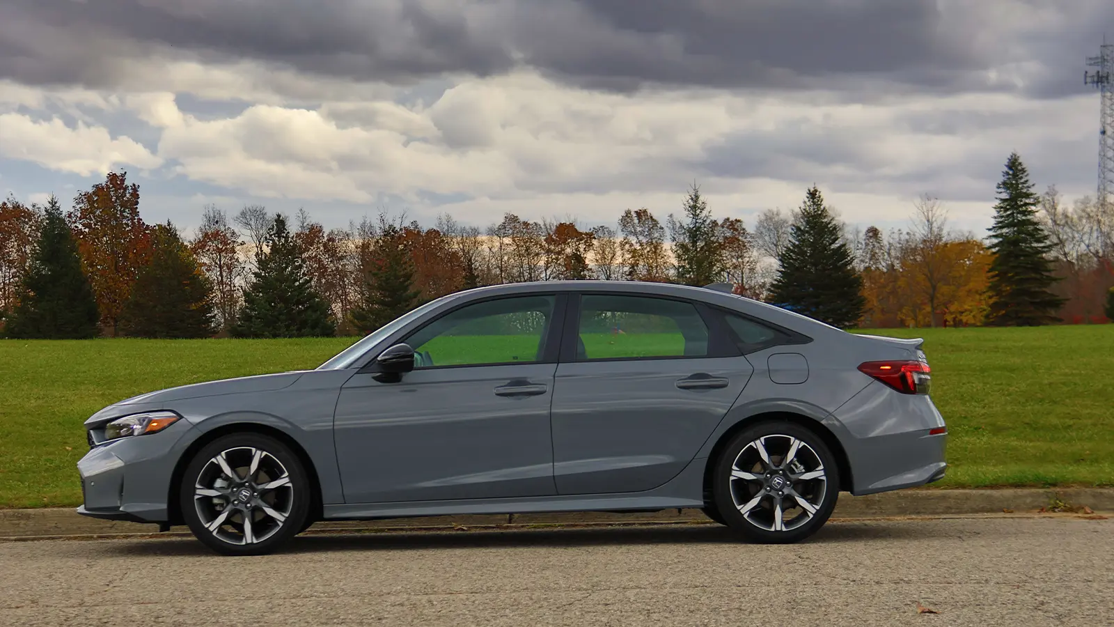 a gray 2026 honda civic hybrid side view
