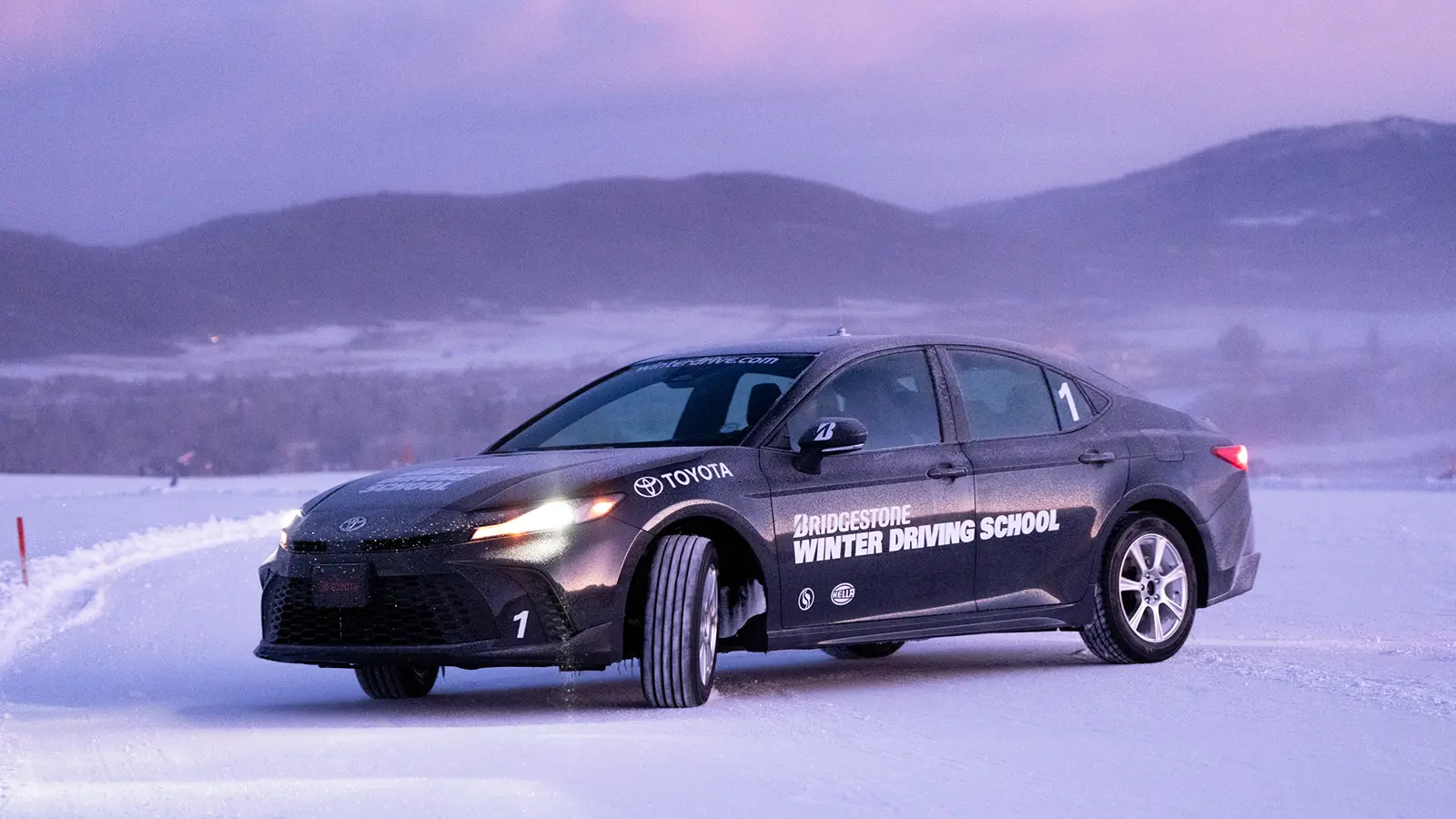 A 2026 Toyota Camry All-Wheel Drive playing in the snow