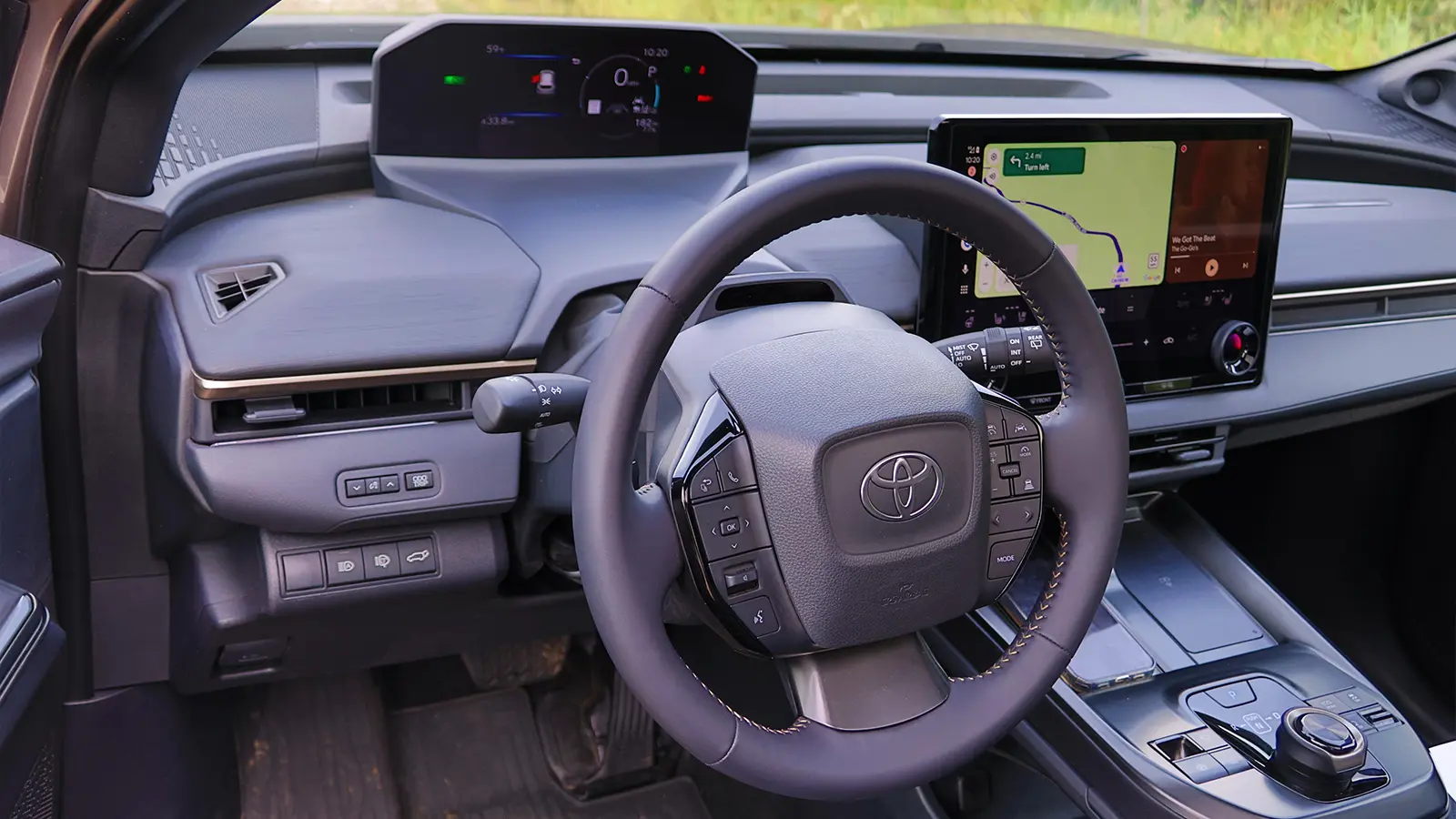 A 2026 Toyota bZ Woodland in the forest driver interior front view 