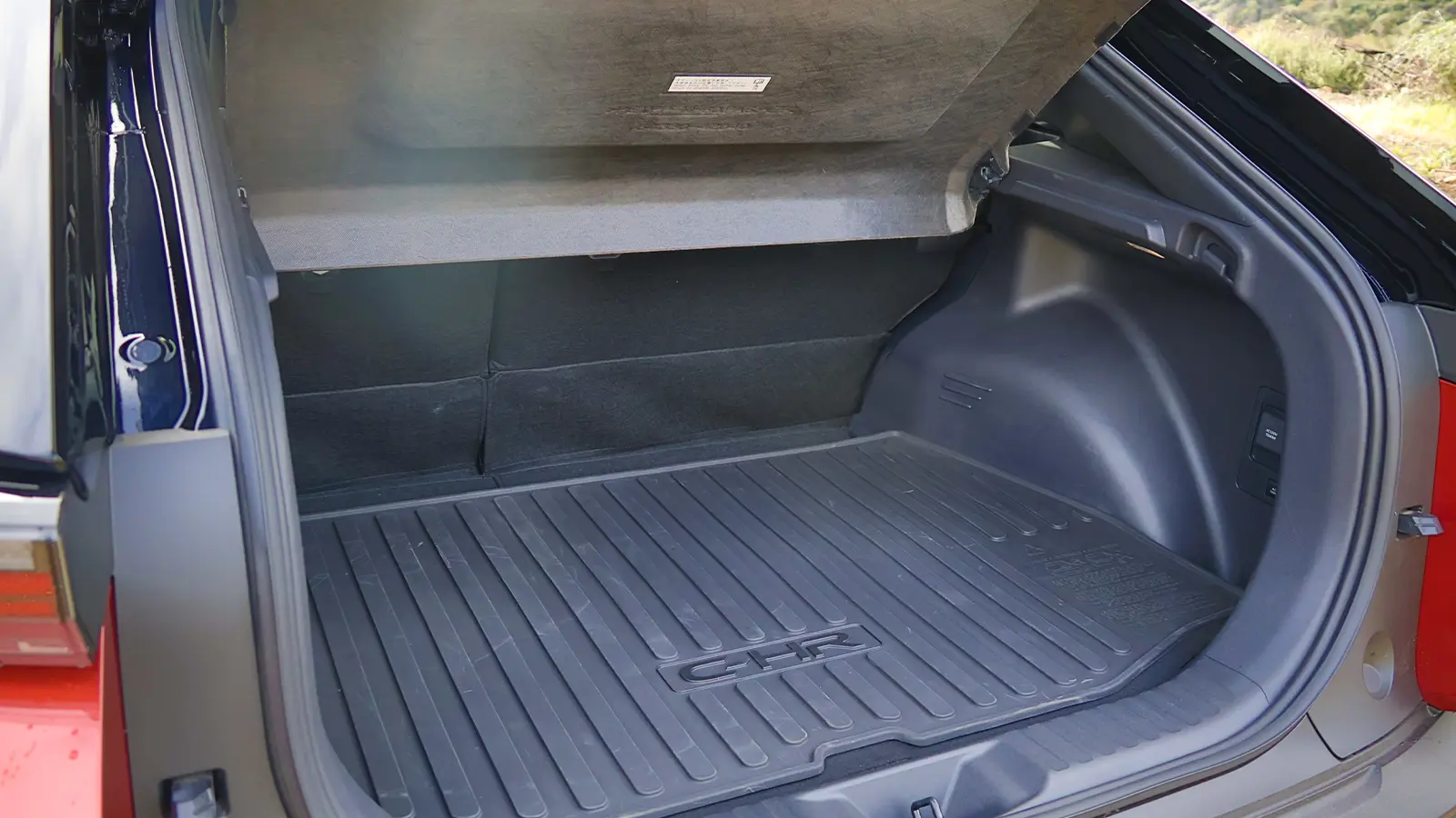 A red 2026 Toyota C-HR rear trunk view