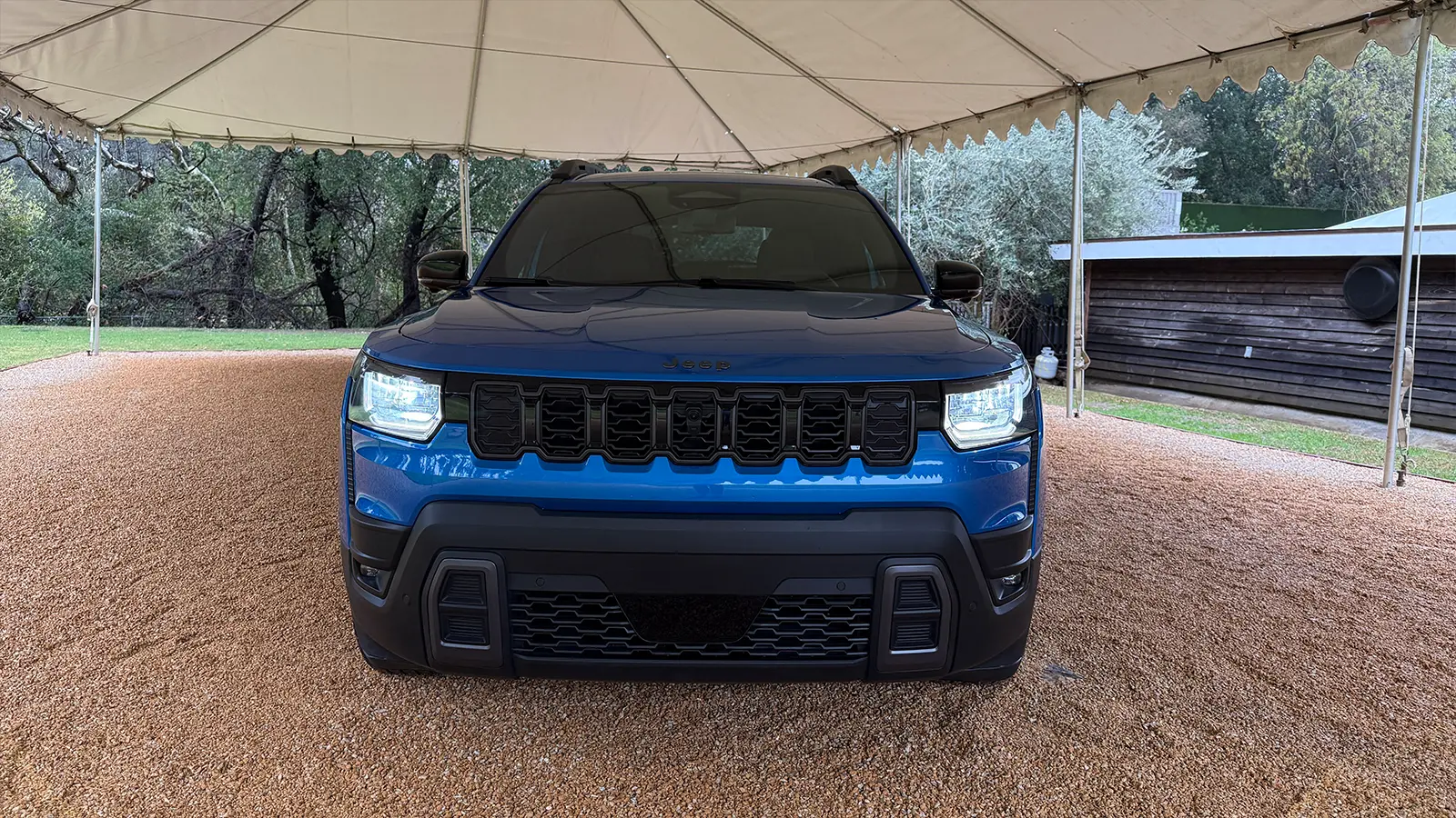 A blue 2026 Jeep Cherokee front nose view