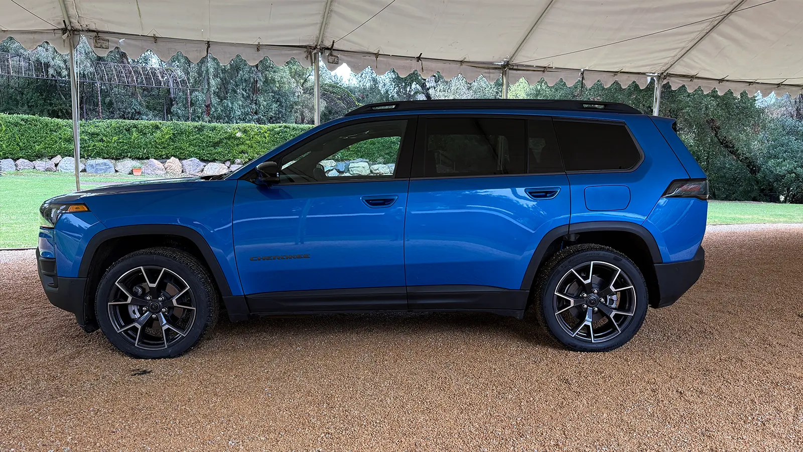 A blue 2026 Jeep Cherokee side view