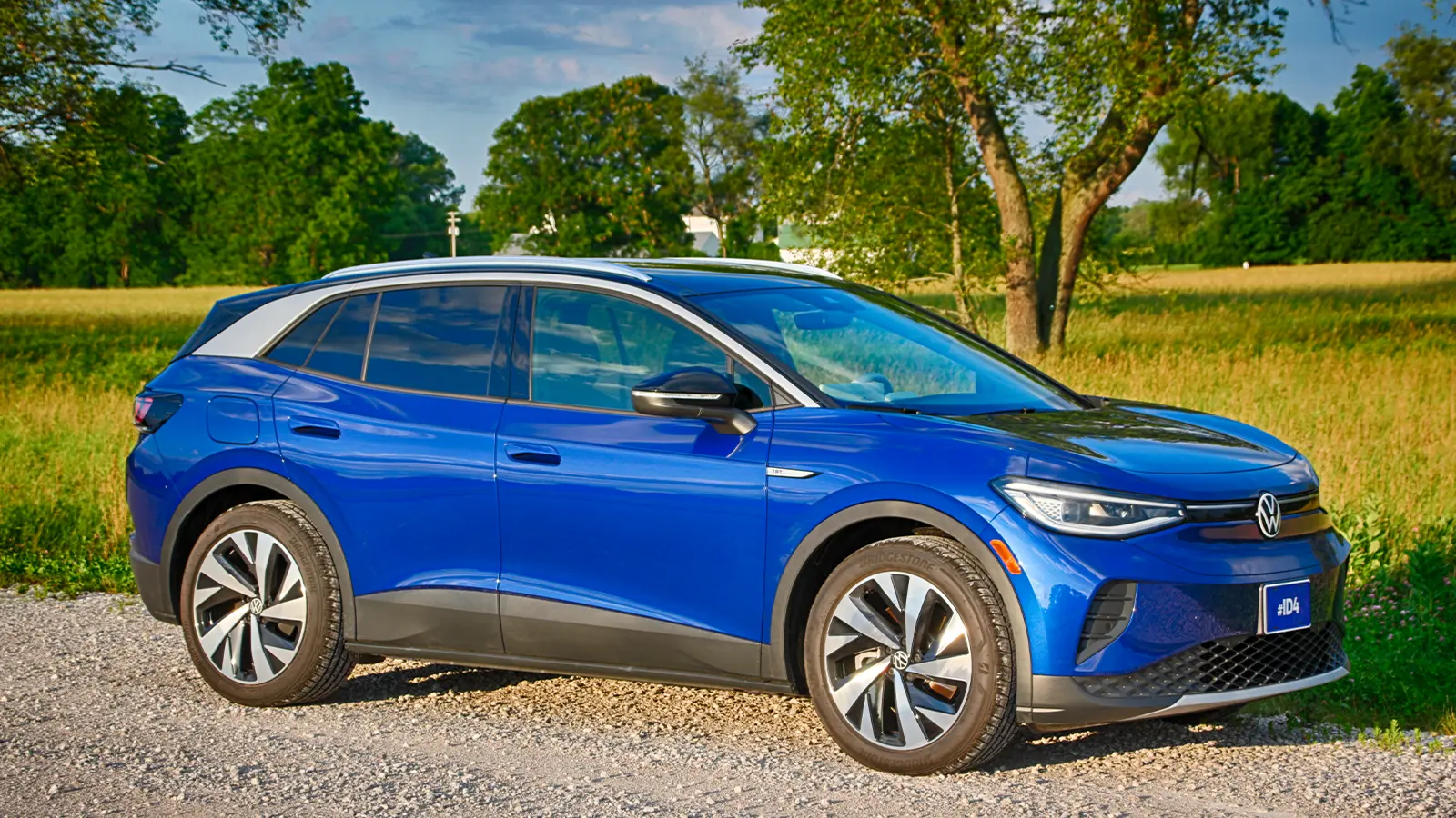 A blue VW ID.4 rear three quarter front view