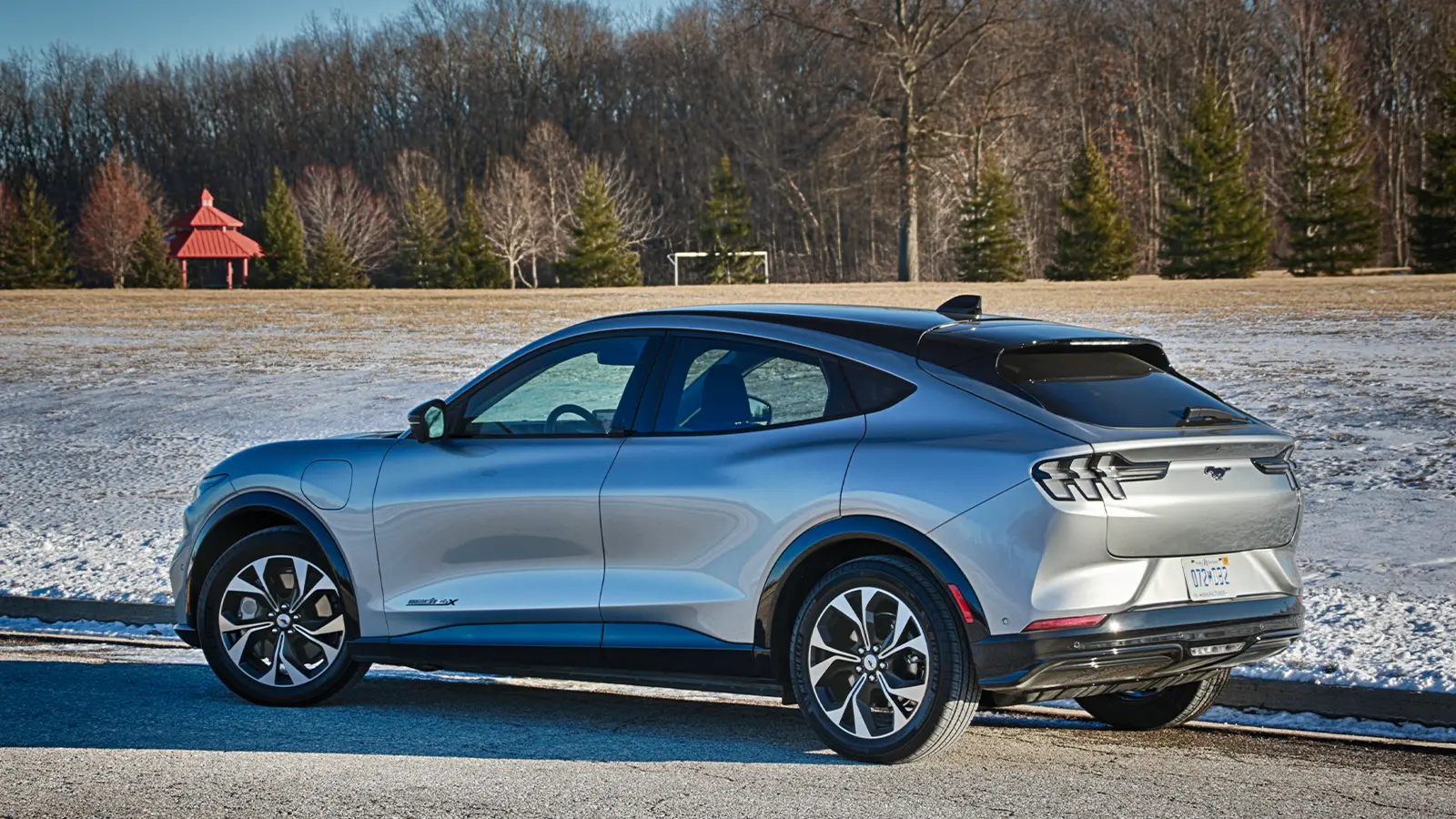 A silver Ford-Mustang Mach e three quarter rear view