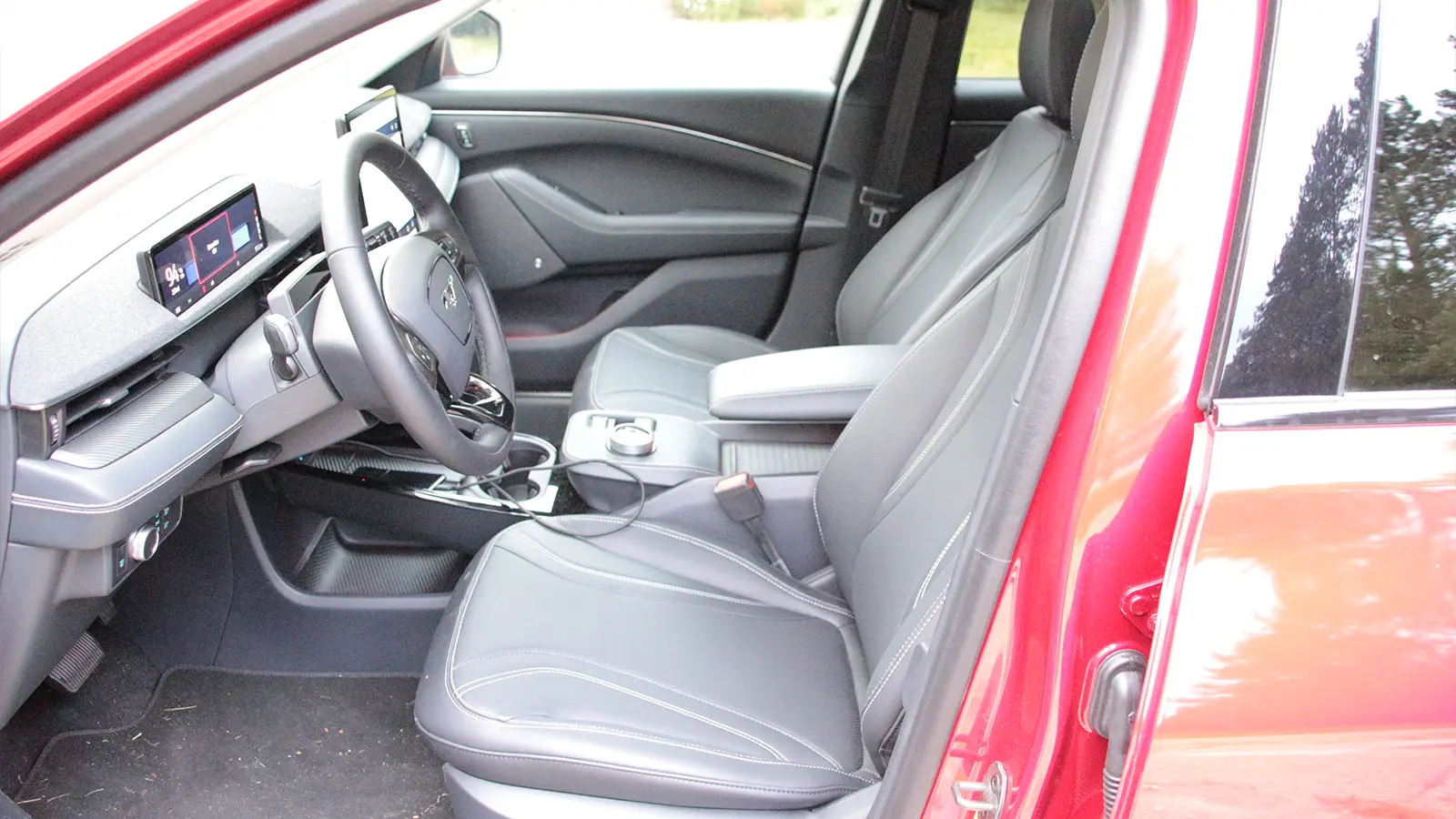 A silver Ford-Mustang Mach e three quarter driver side view