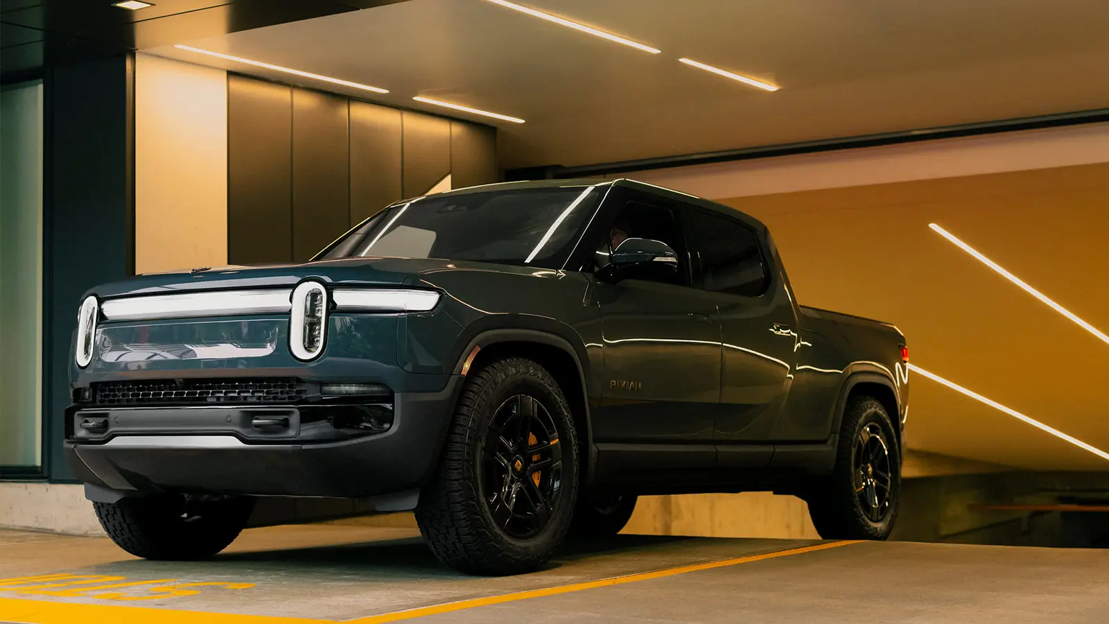 A dark blue Rivian R1T