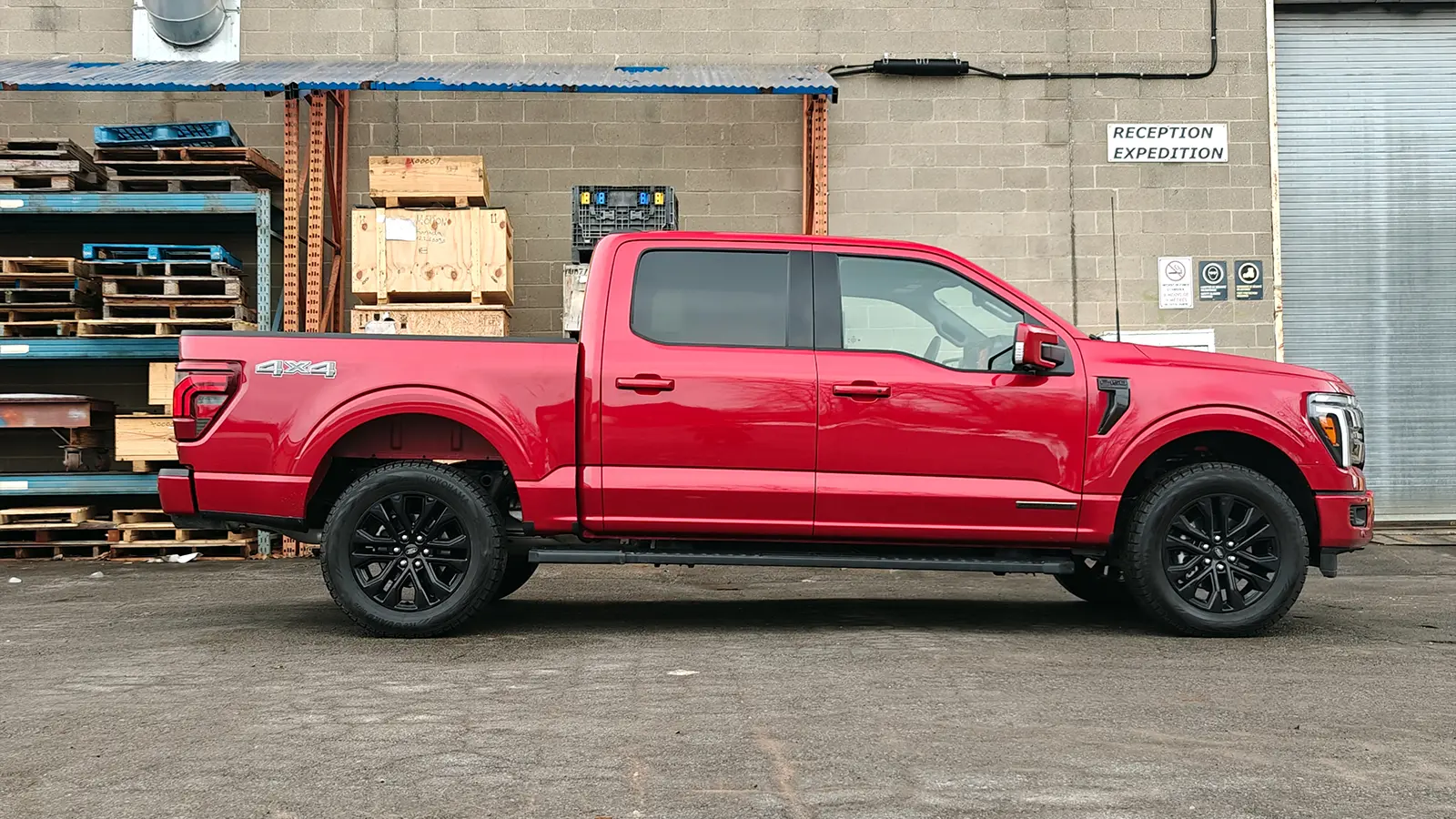 A red 2025 Ford F-150 Powerboost