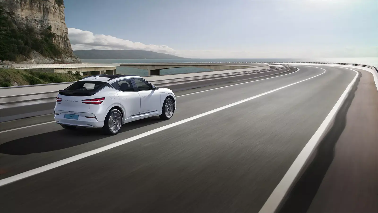 A Genesis GV60 on the road