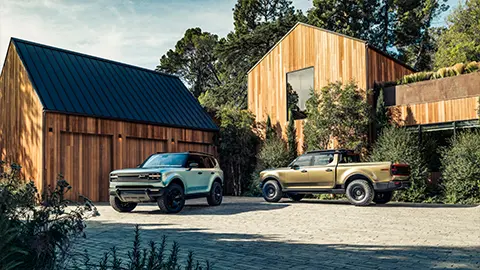 A Scout Traveler and Terra in front of a barn