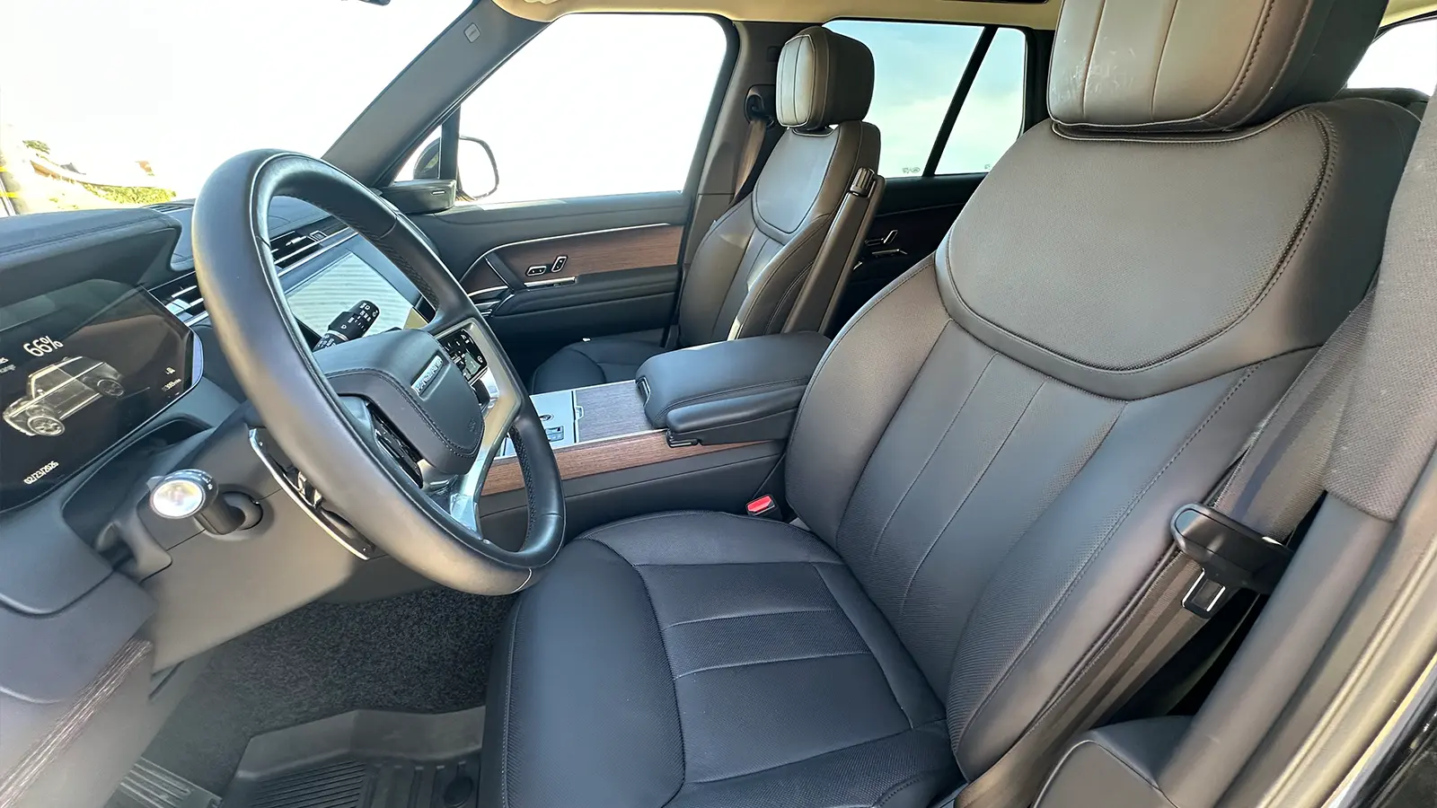 A black 2025 Land Rover Range Rover SE PHEV Review driver front side view