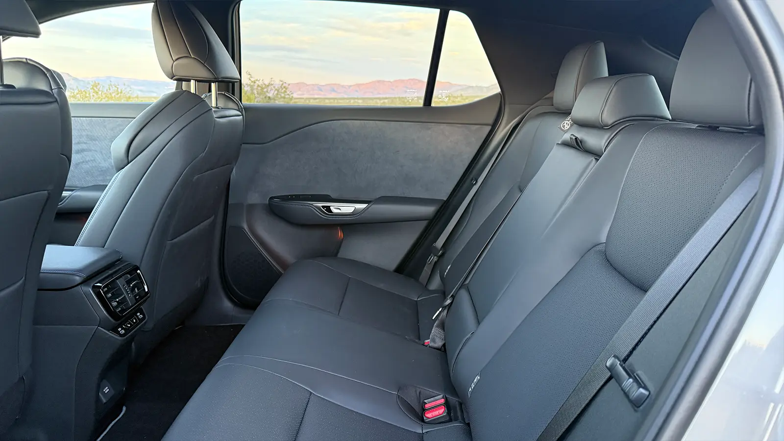 A gray 2026 Lexus RZ550e F Sport Review rear seat view