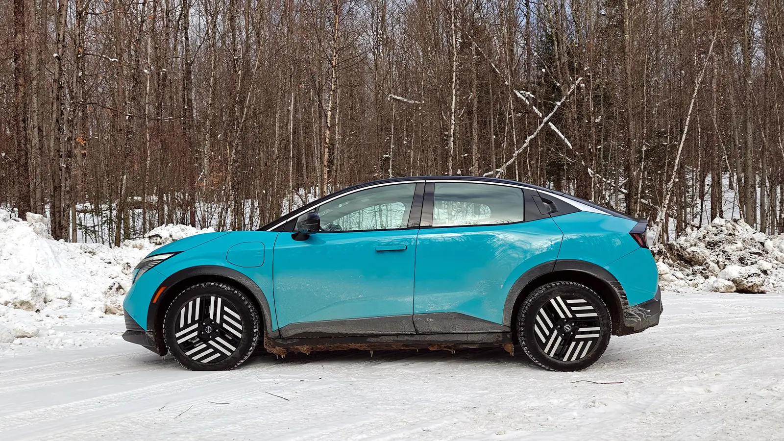 A teal 2026 Nissan Leaf side view