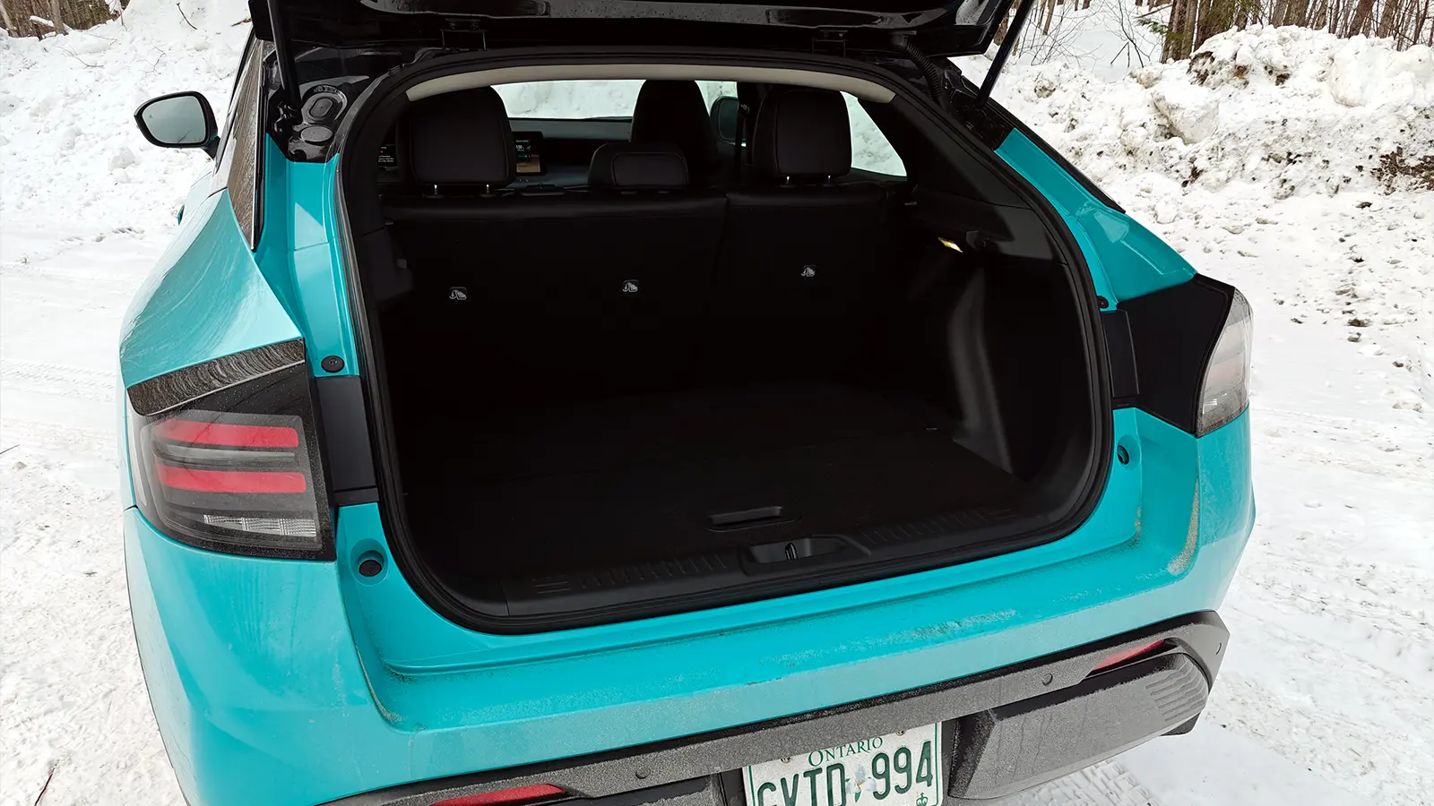 A teal 2026 Nissan Leaf trunk lid open
