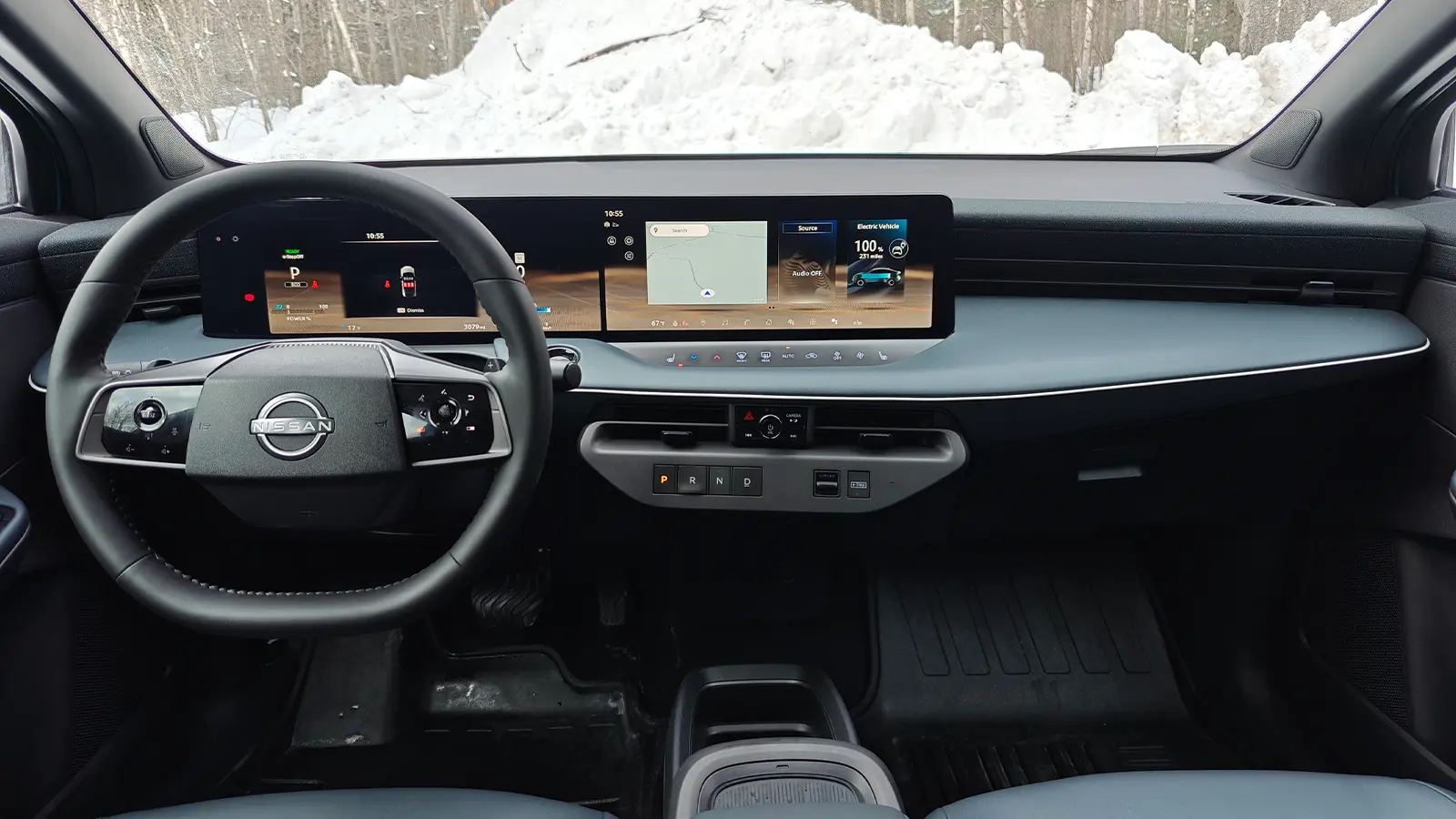 A teal 2026 Nissan Leaf interior driver front HUD view