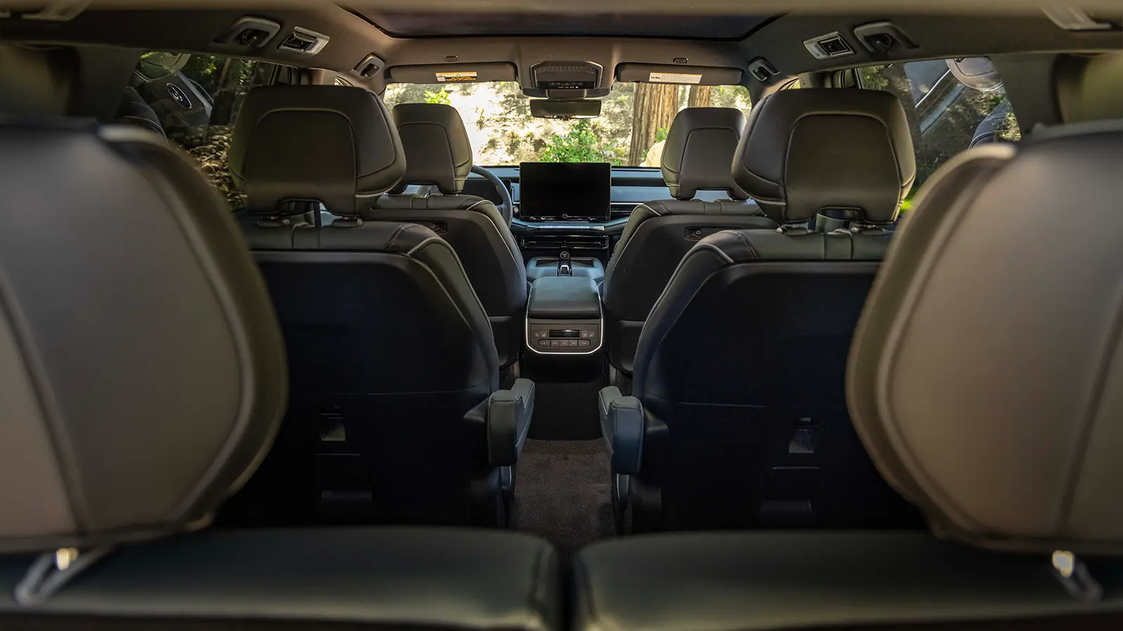 A 2027 Subaru Getaway interior rear view from the 3rd row seat looking forward