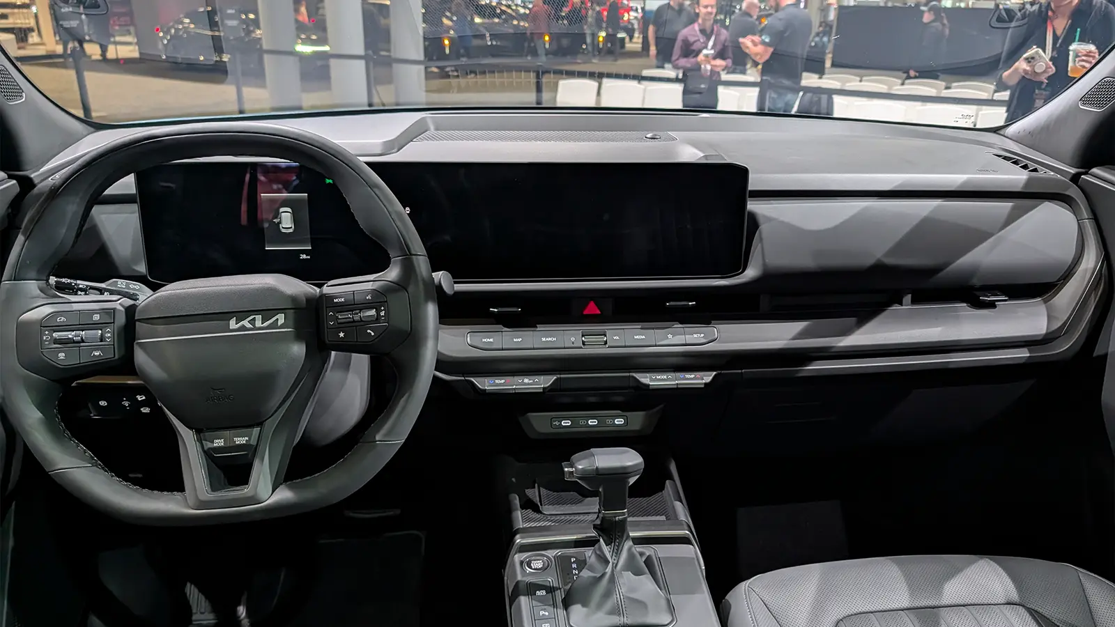 A light gold 2027 Kia Seltos interior driver front view HUD at the 2026 NY Auto Show