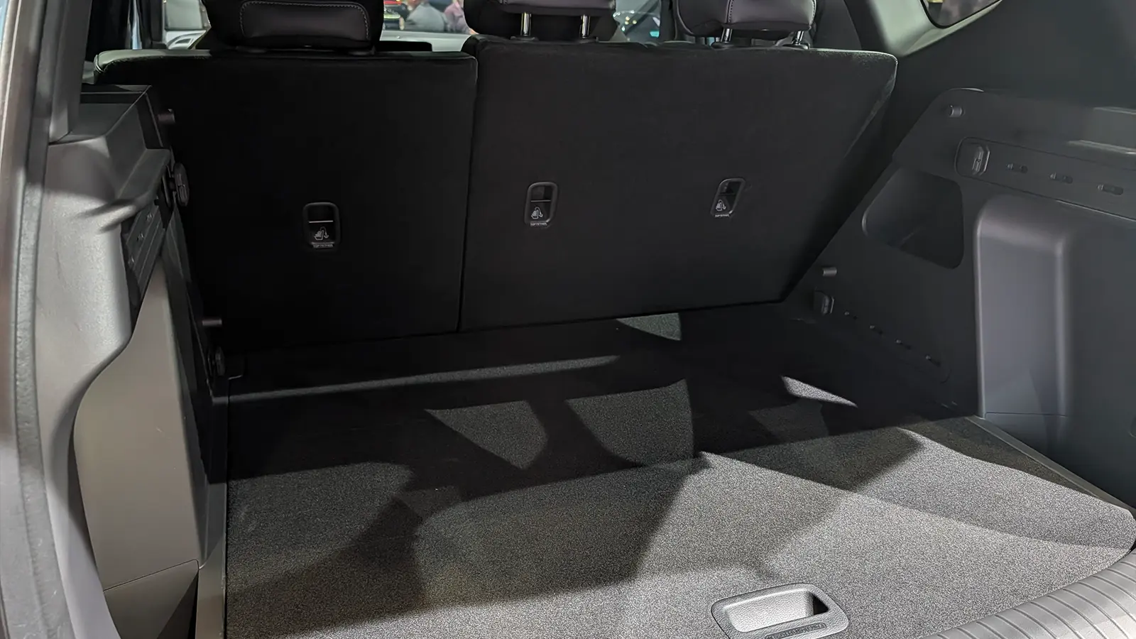 A light gold 2027 Kia Seltos interior rear trunk cargo bay view at the 2026 NY Auto Show