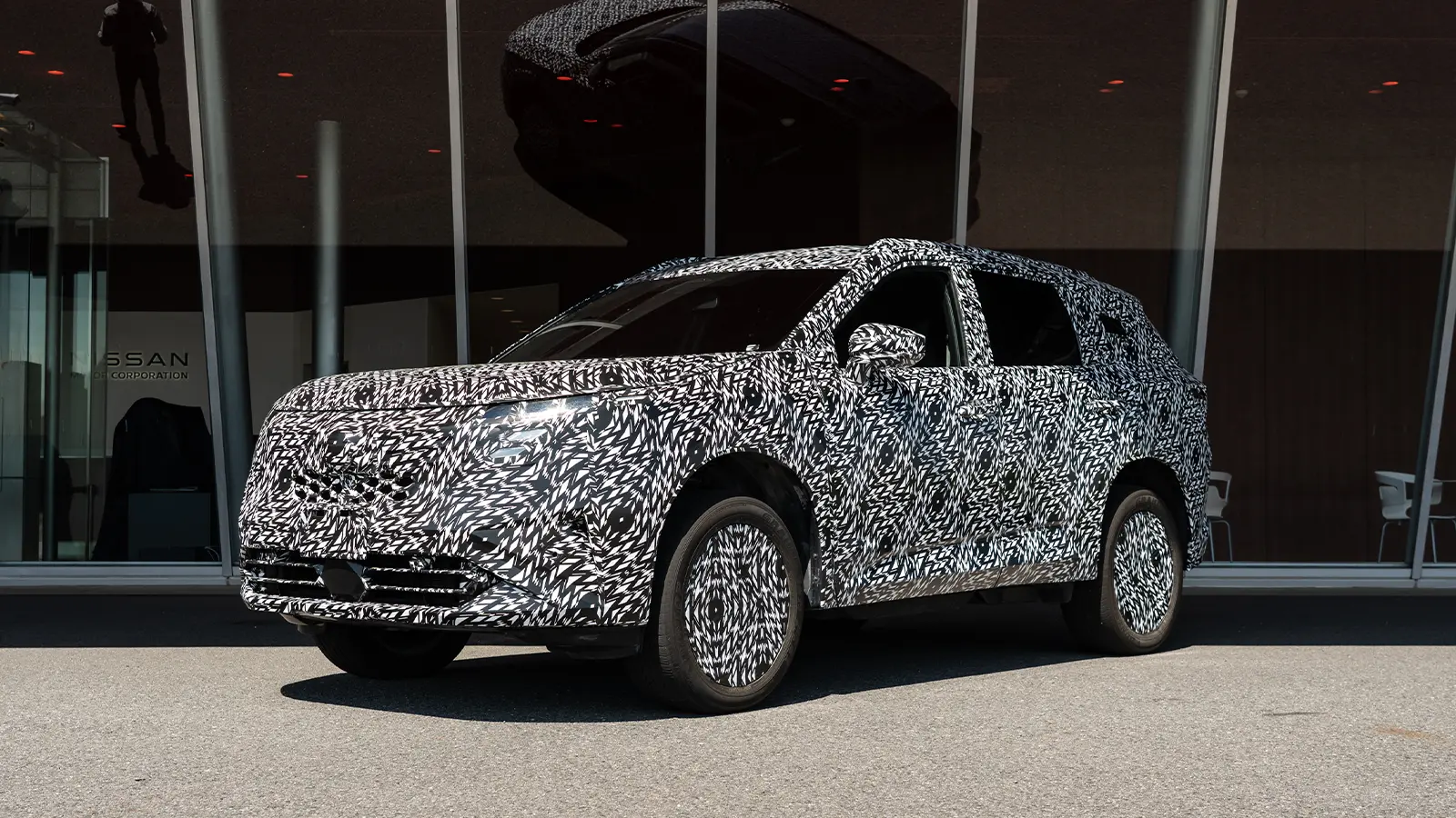 A 2027 Rogue e Power prototype first drive three quarter front view 