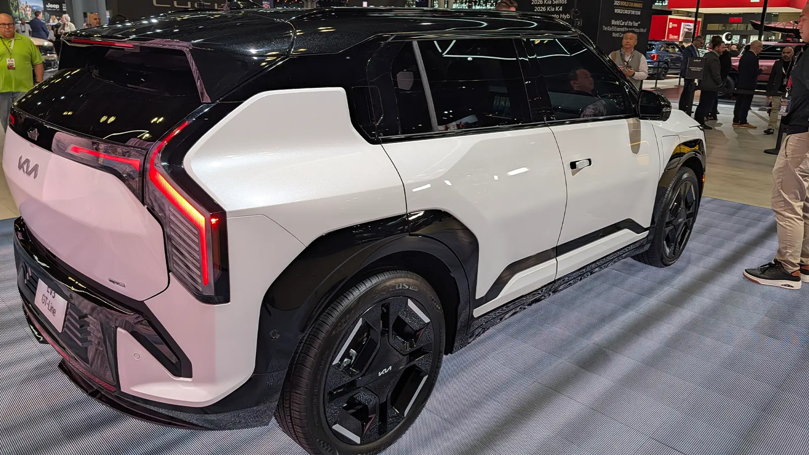 A white 2027 Kia EV3 three quarter rear view