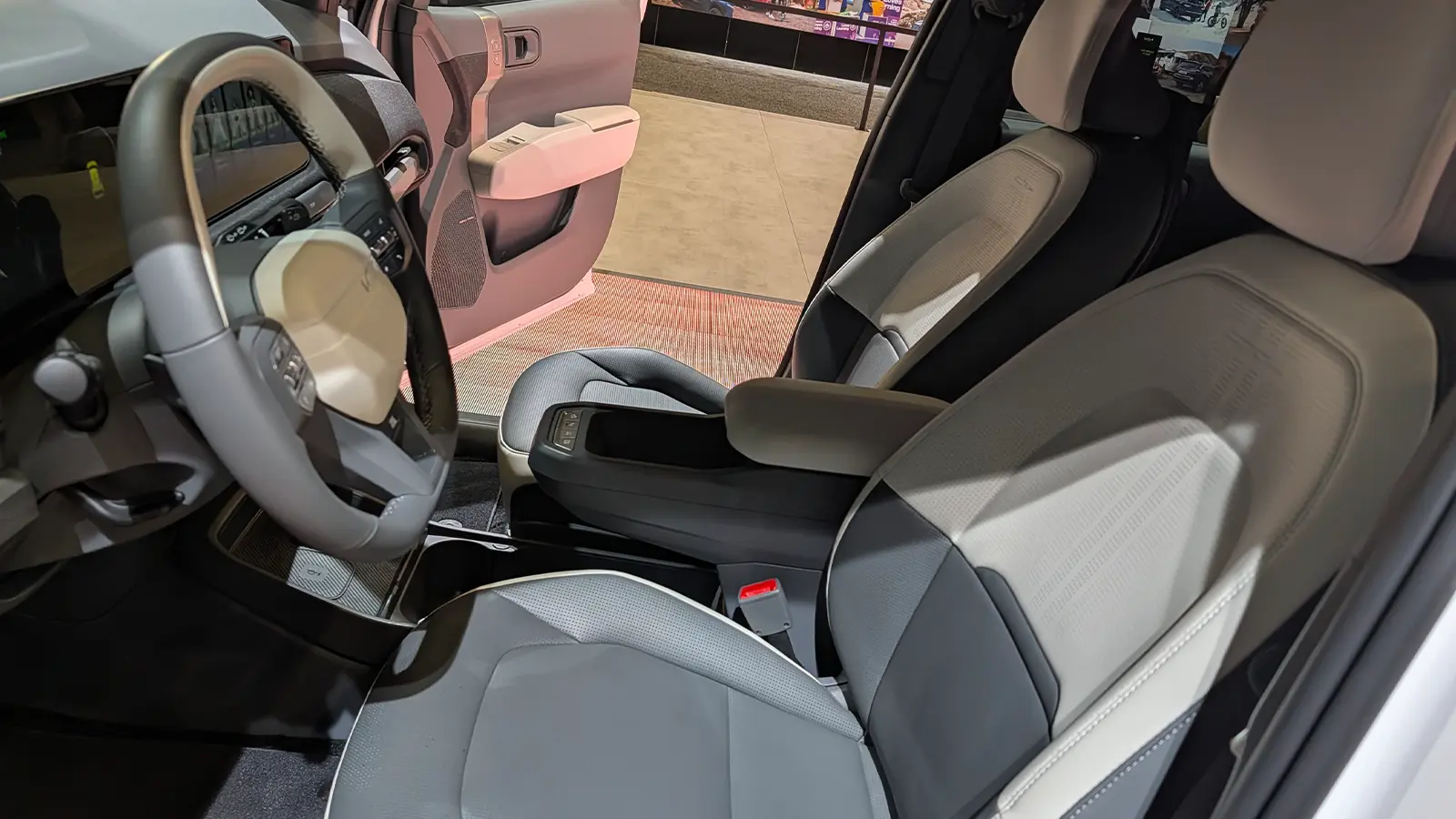 A white 2027 Kia EV3 driver side view