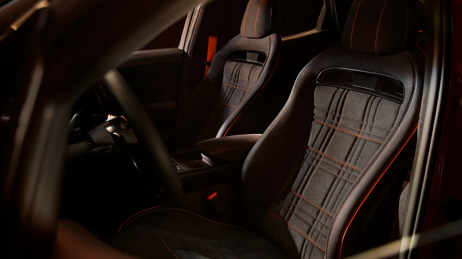 A 2027 Orange Genesis GV60 Magma interior driver front view