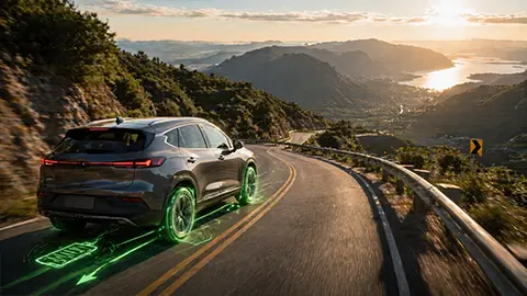 A EV SUV driving down a mountain 