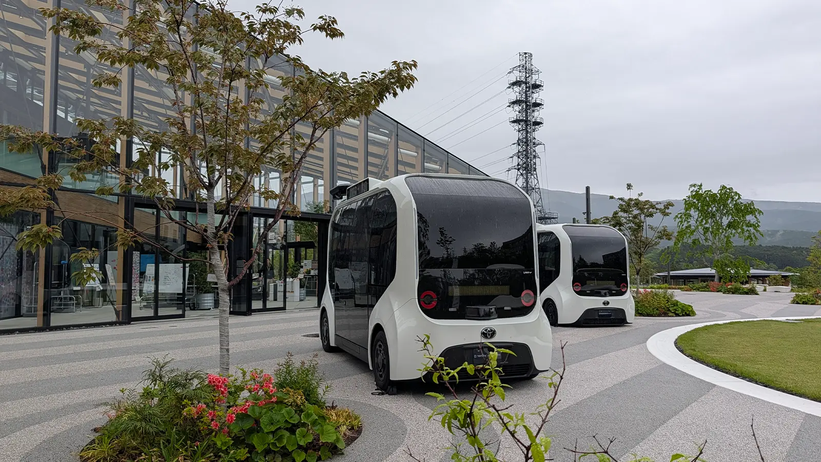 A front view of Toyotas woven city main entrances with buses