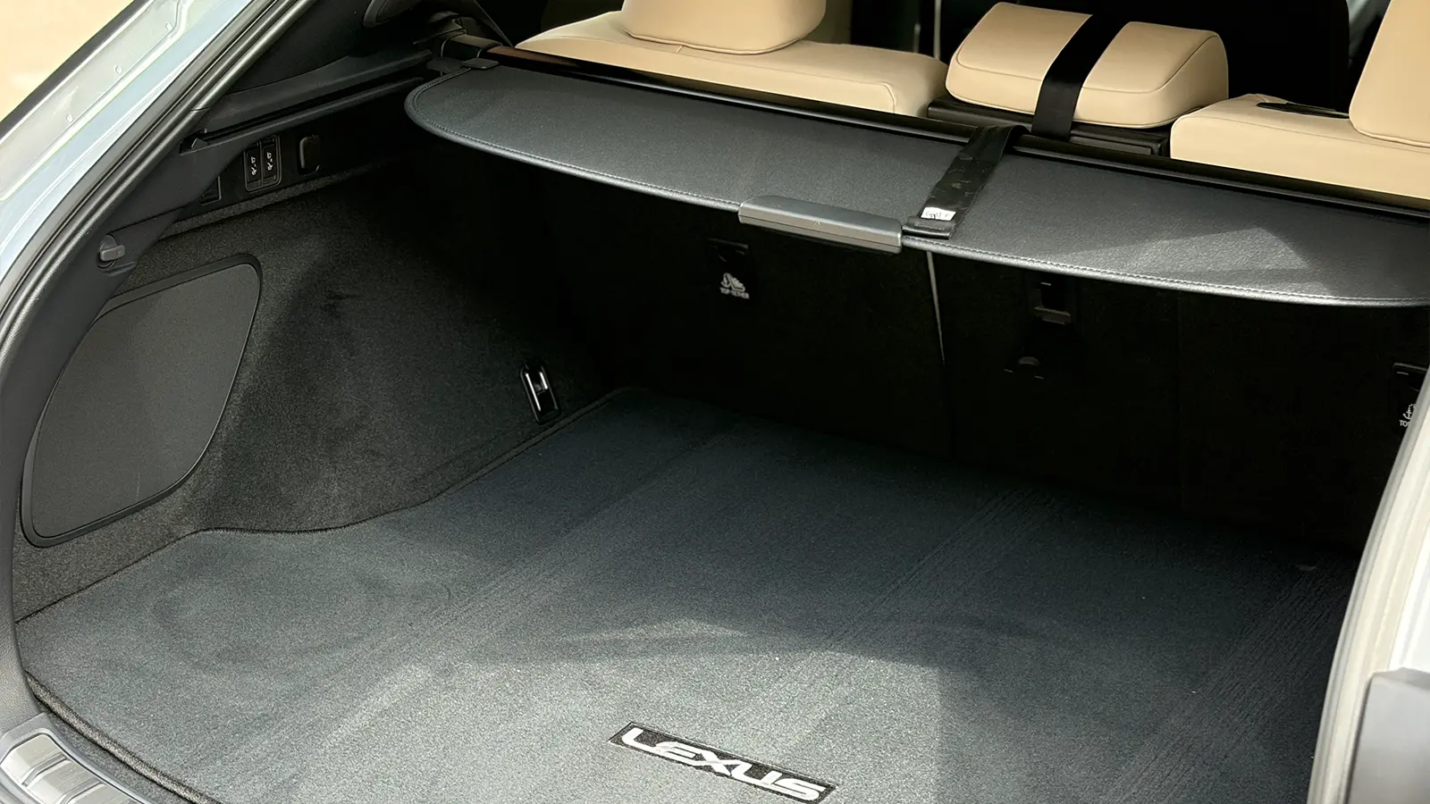 A silver Lexus RX 450h+ interior rear cargo bay
