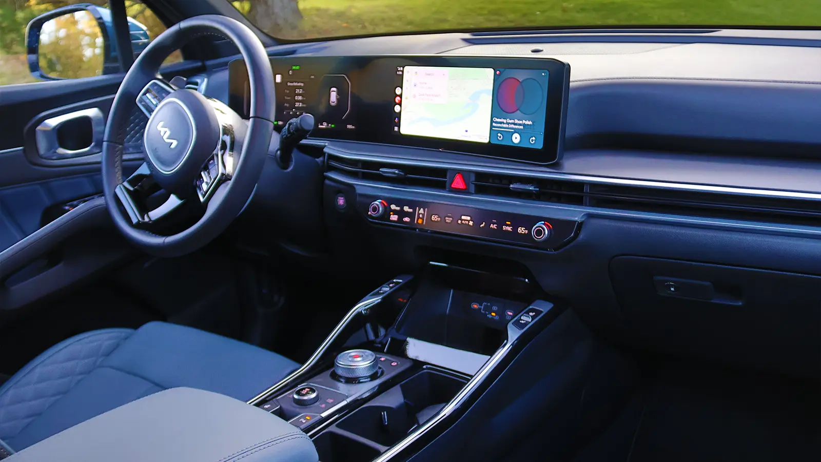 A blue 2026 Kia Sorrento interior driver HUD view