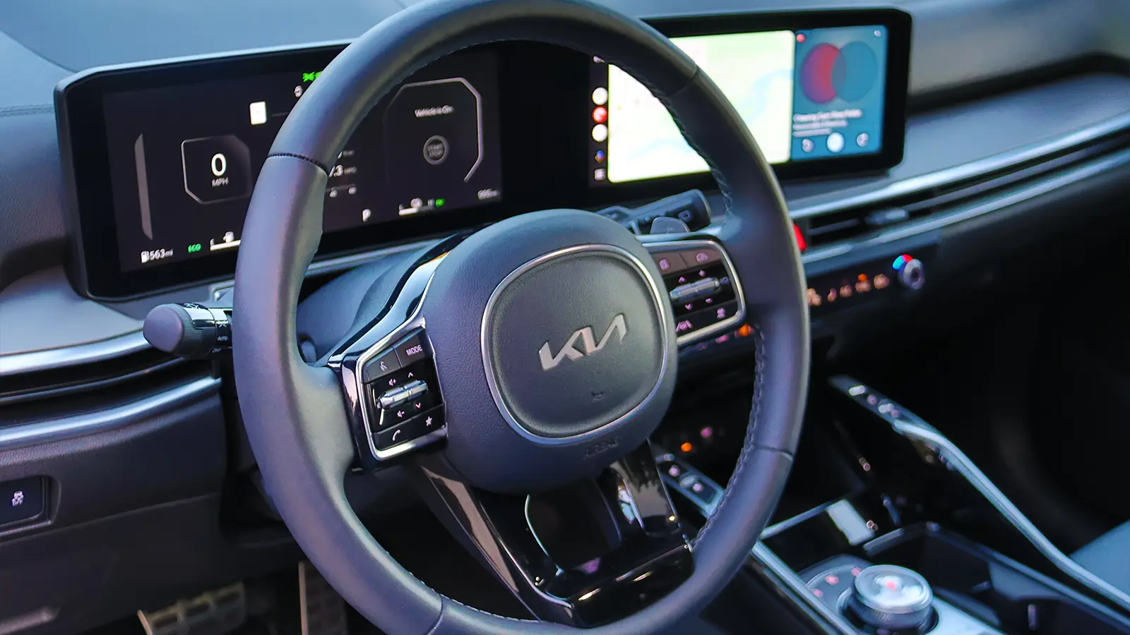 A blue 2026 Kia Sorrento hybrid interior driver center HUD zoomed in
