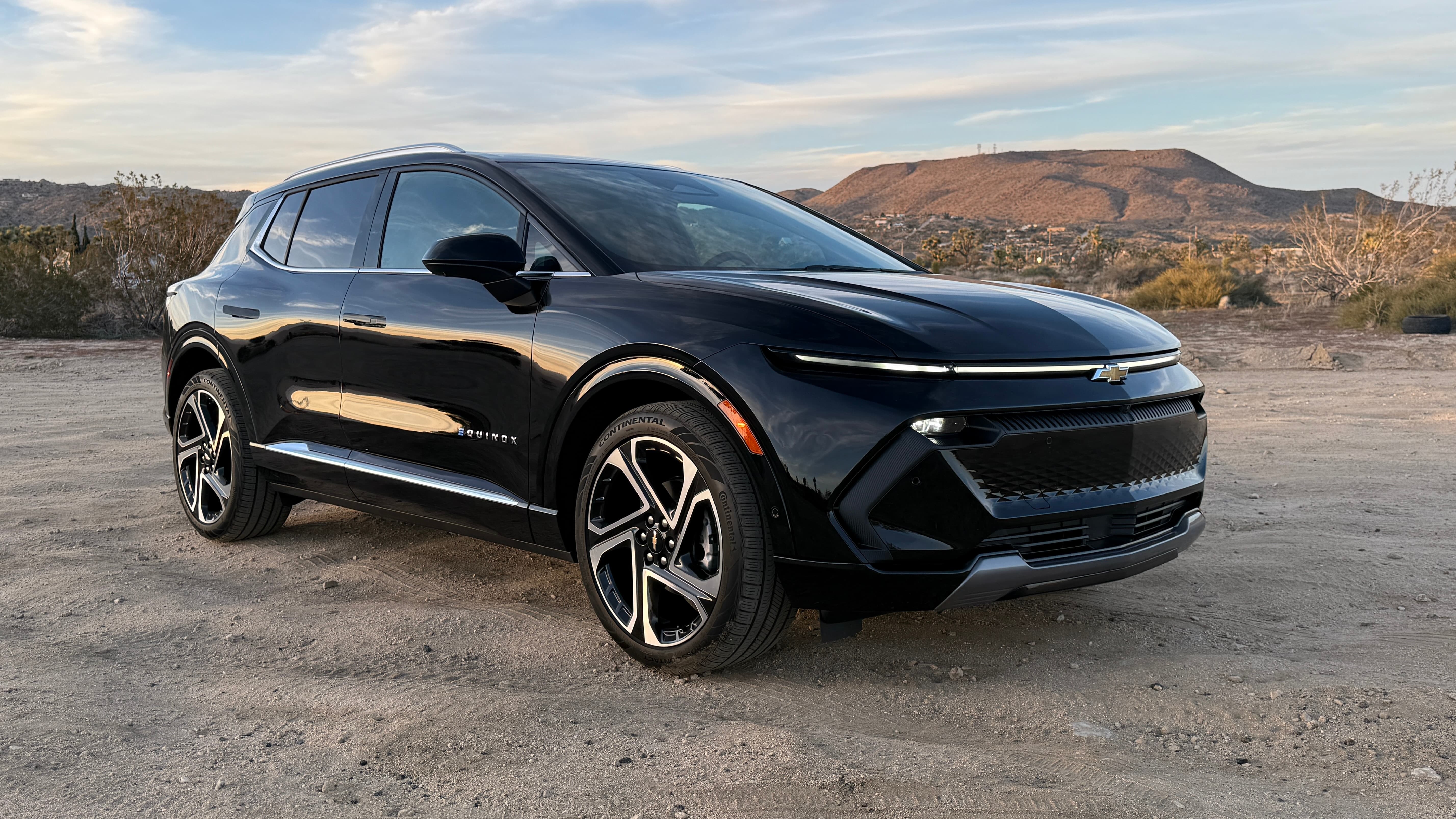 A black 2026 Chevrolet Equinox EV in the desert