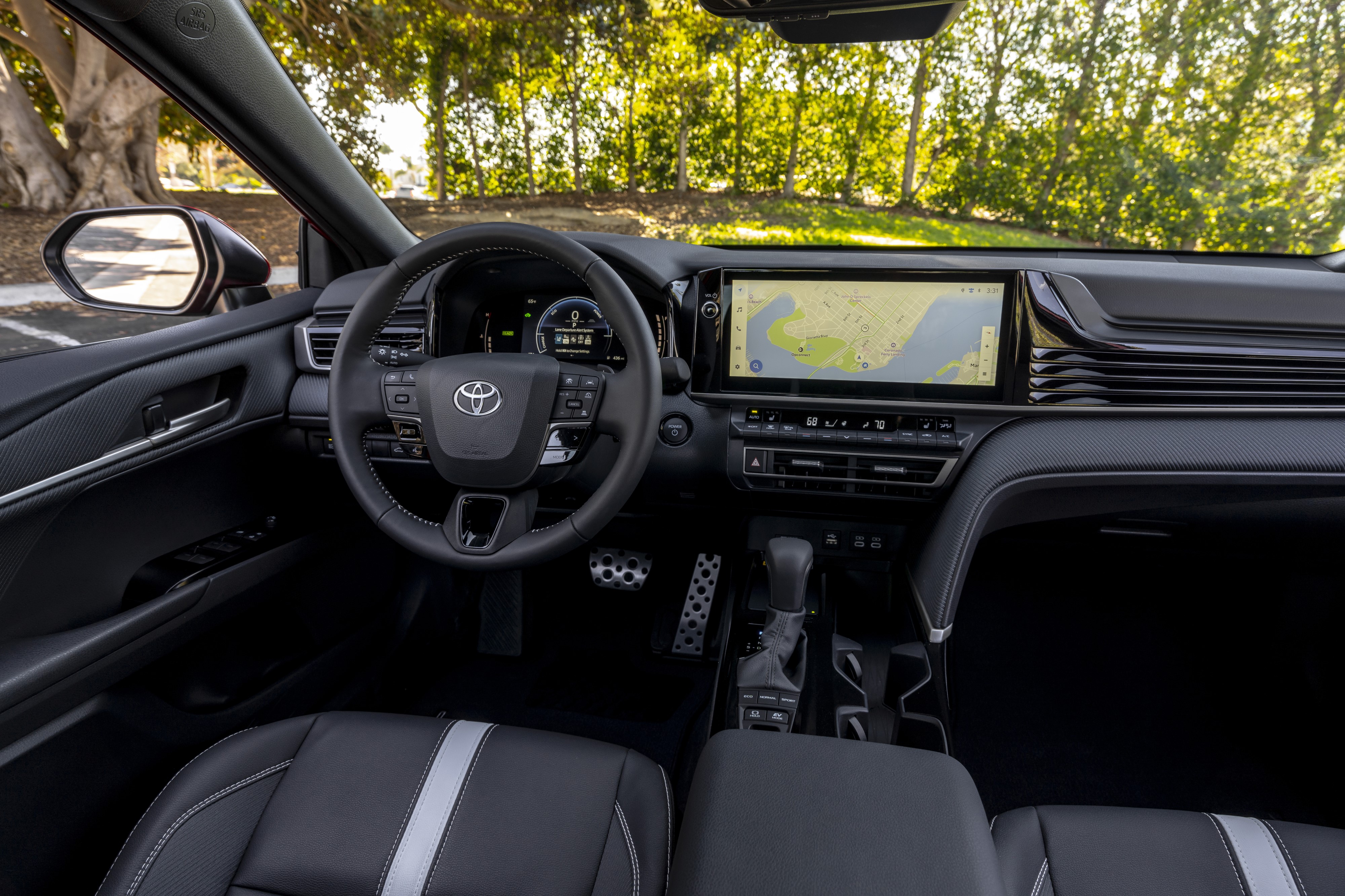 The interior view of the 2026 Toyota hybrid front driver HUD