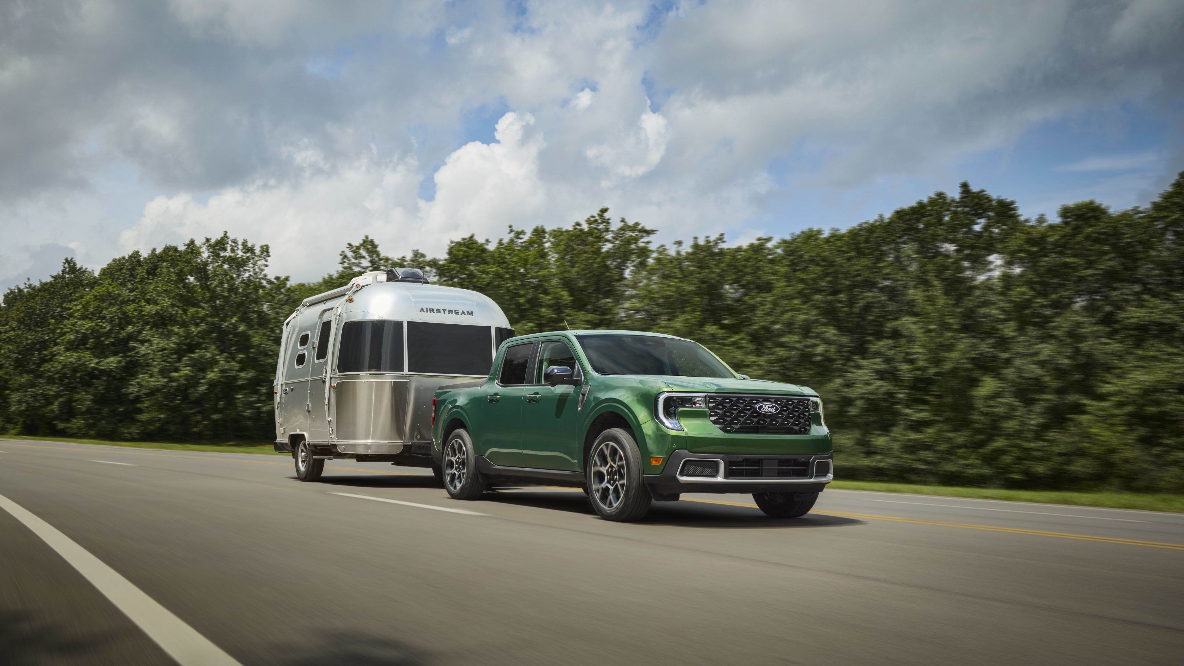 The Ford Maverick Hybrid with an Airstream on the highway