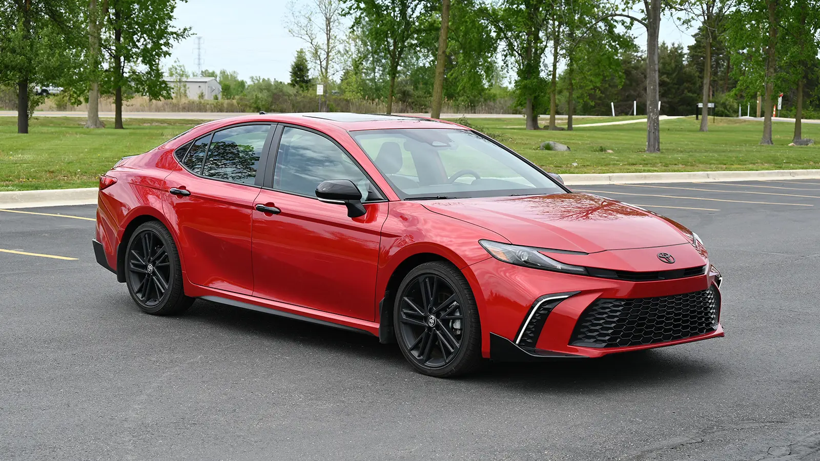 2026 Red Toyota Camry Nightshade standing in a parking lot outside