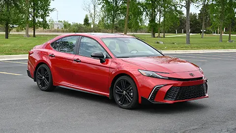 2026 Red Toyota Camry Nightshade standing in a parking lot outside