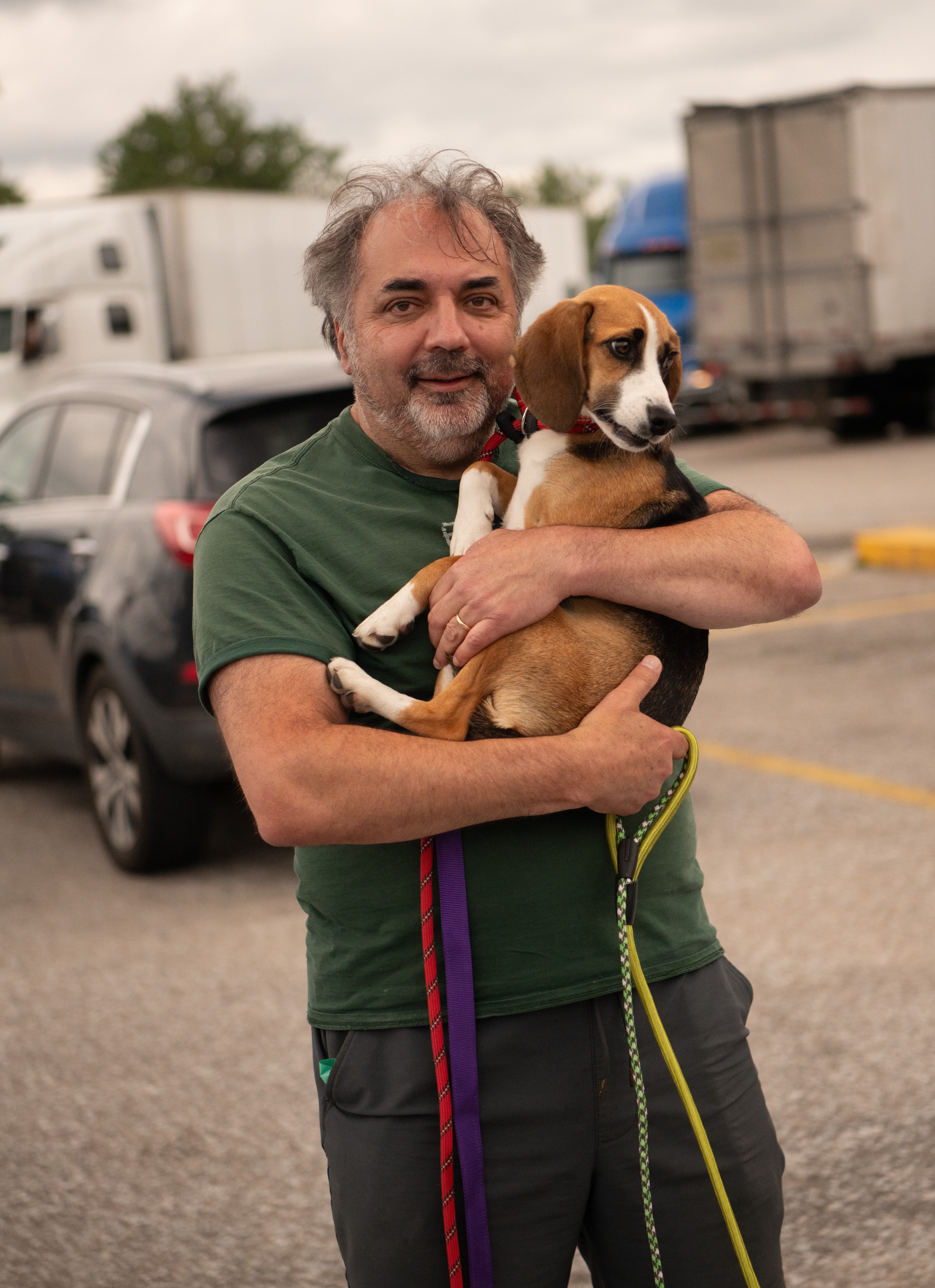 Sam Abuelsamid holding a rescue Beagle