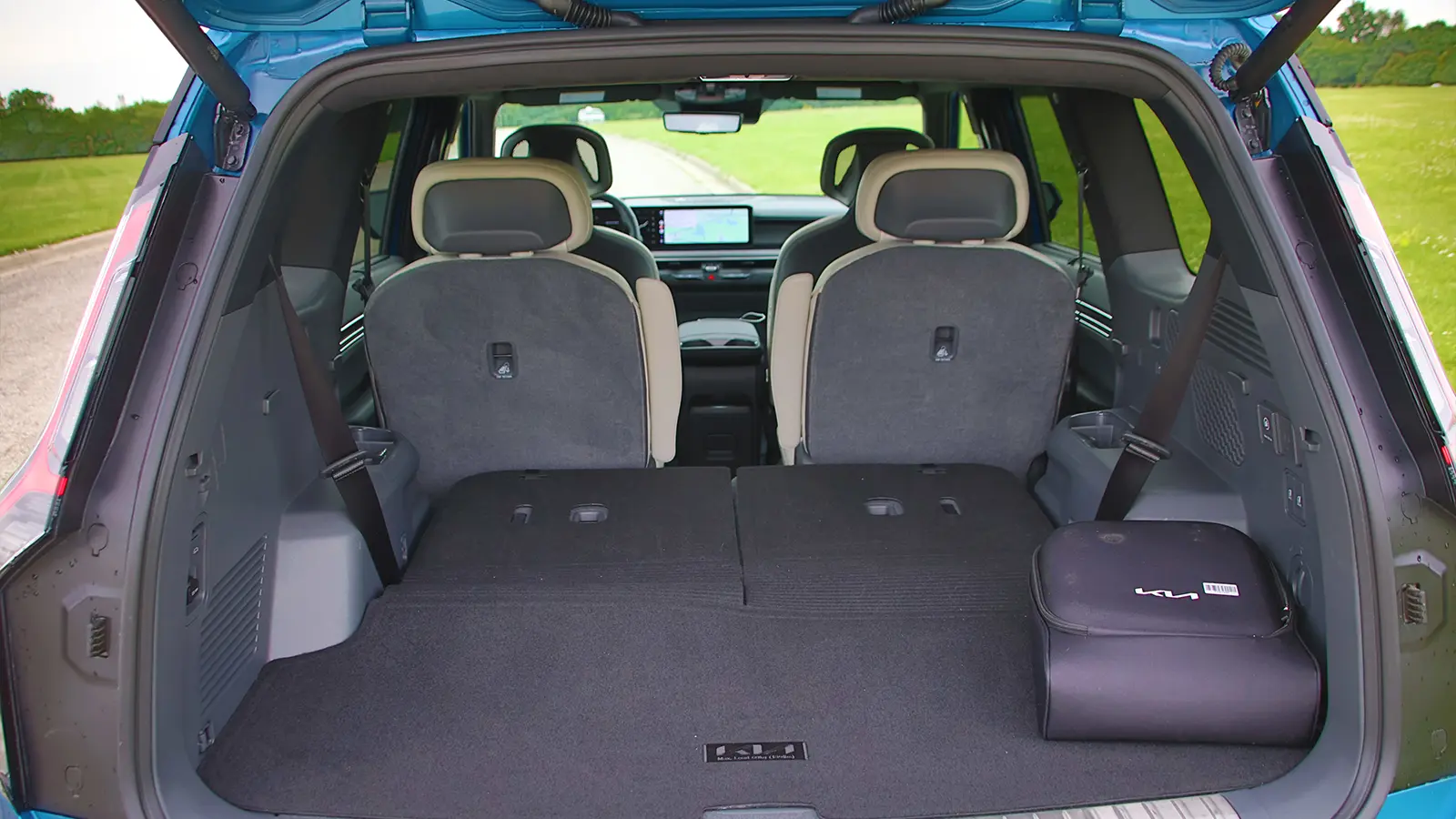 A blue 2026 Kia EV9 GT rear cargo view