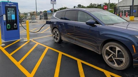 Blue Hyundai EV charging at a Walmart public charging station