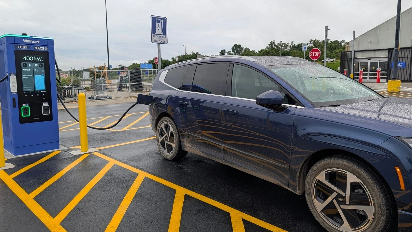 Blue Hyundai EV charging at a Walmart public charging station