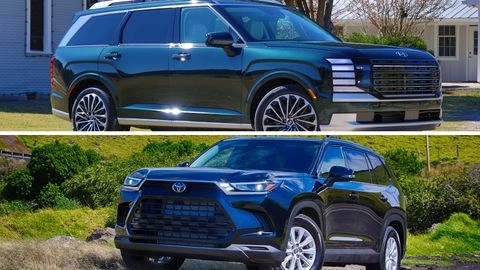 Grey Hyundai Palisade Hybrid side profile on the left with a red Toyota Grand Highlander Hybrid side profile on the right.