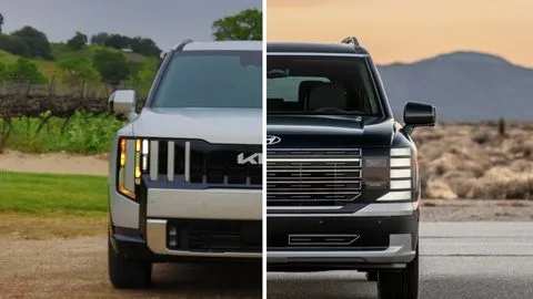 Silver Kia Telluride Hybrid side by side with a Black Hyundai Palisade Hybrid