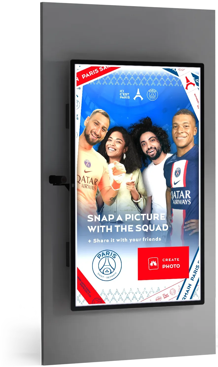 Digital screen showing four people smiling for a photo with Paris Saint-Germain football branding and text 'Snap a picture with the squad'.