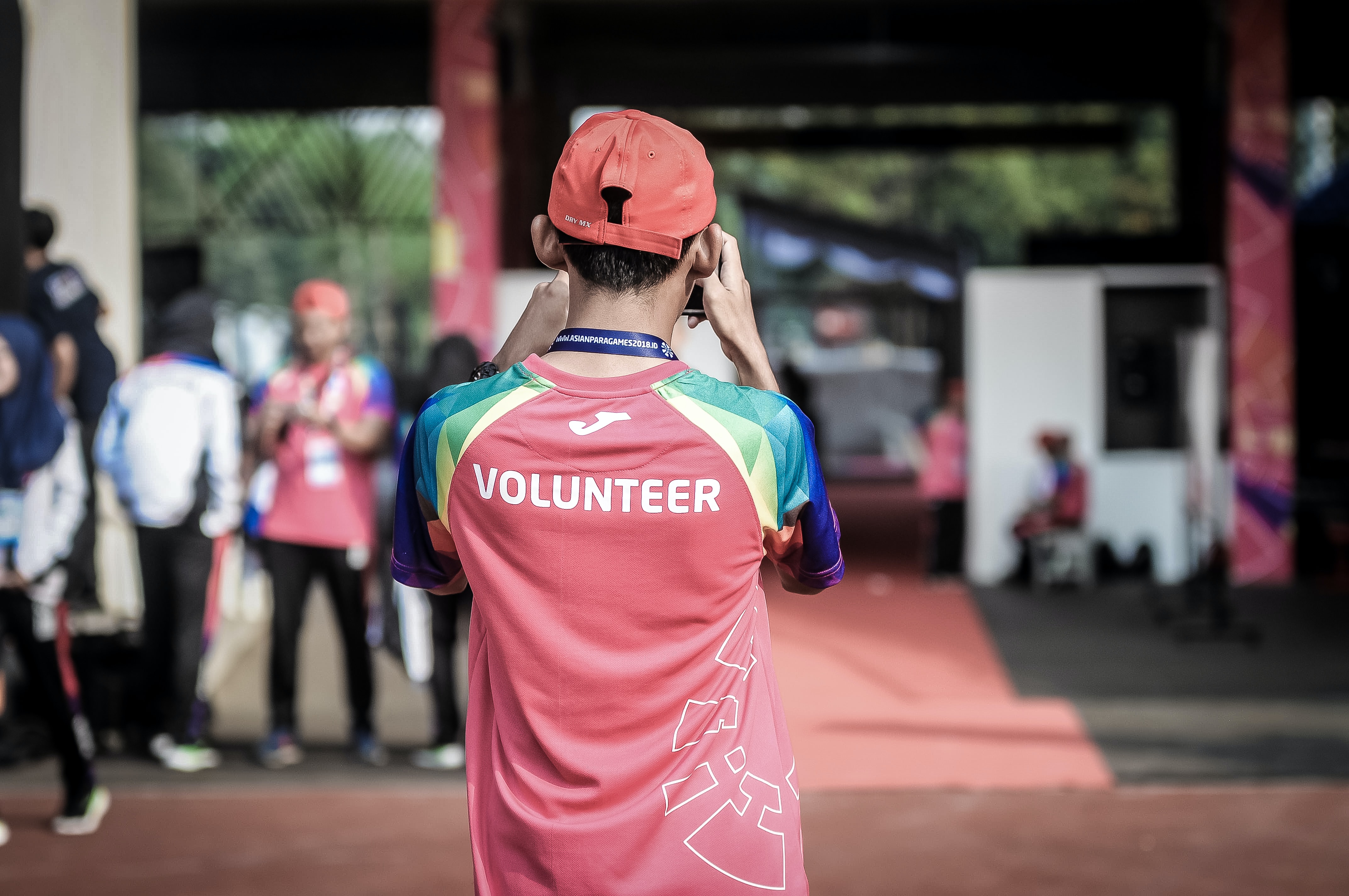 Back of mans shirt, says volunteer