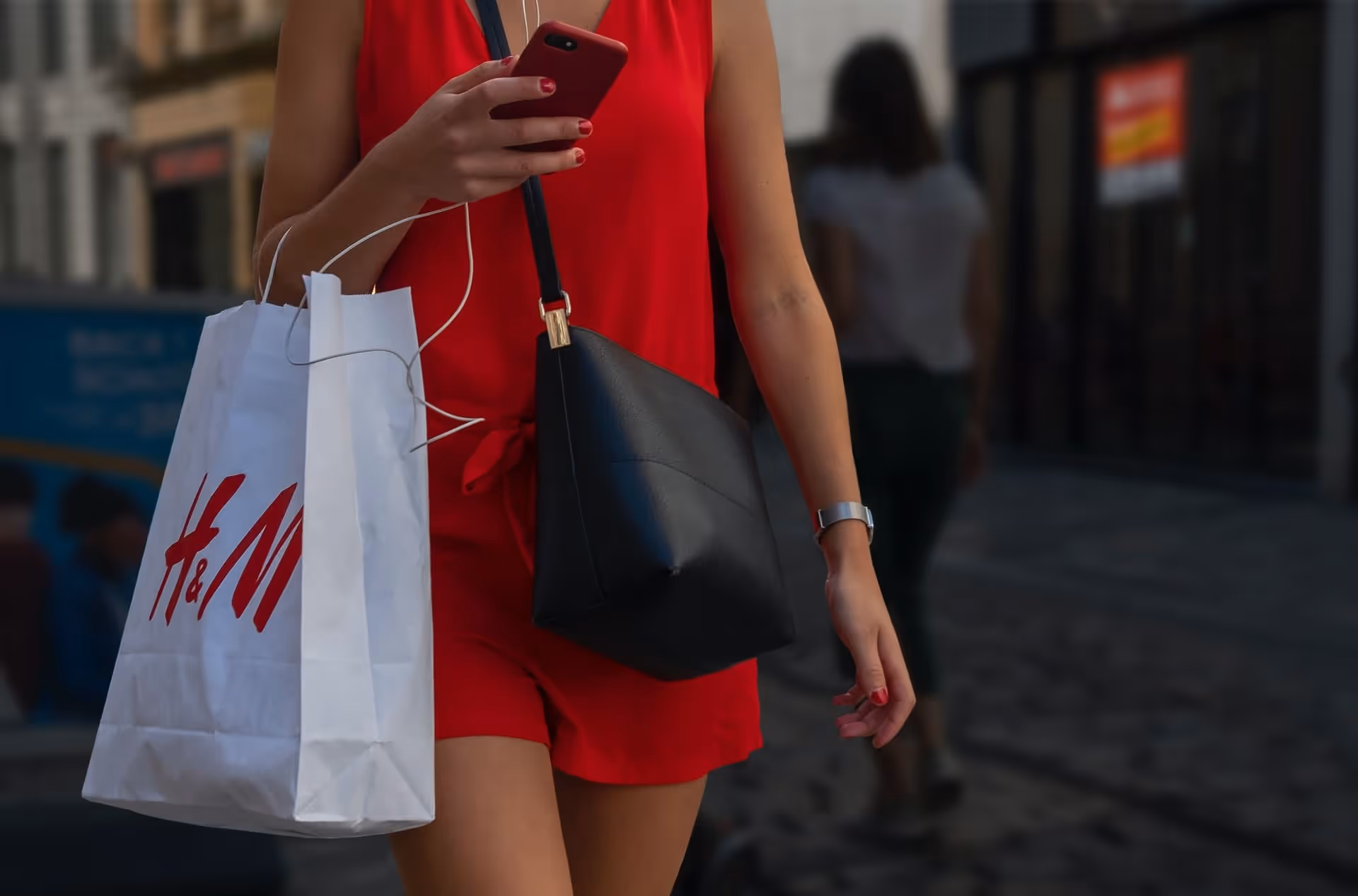 A shopper carrying a H&M bag
