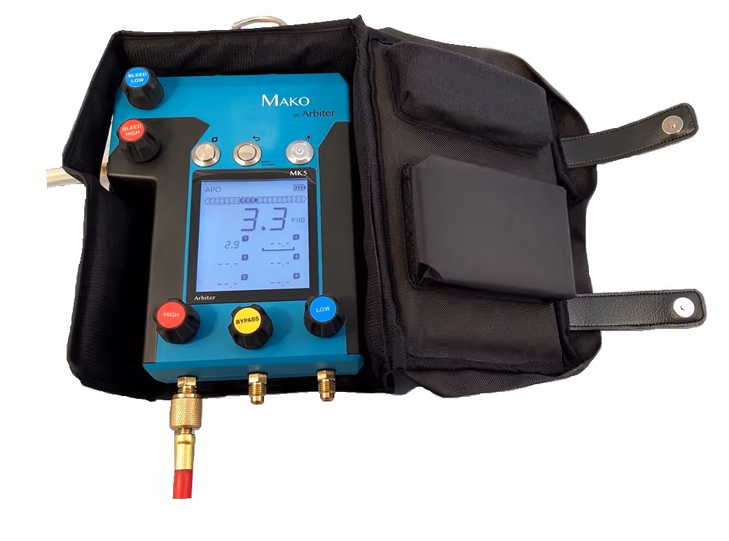 Blue and black Mako MK5 device by Arbiter with control knobs and a digital display showing pressure readings, housed in a black carrying case.